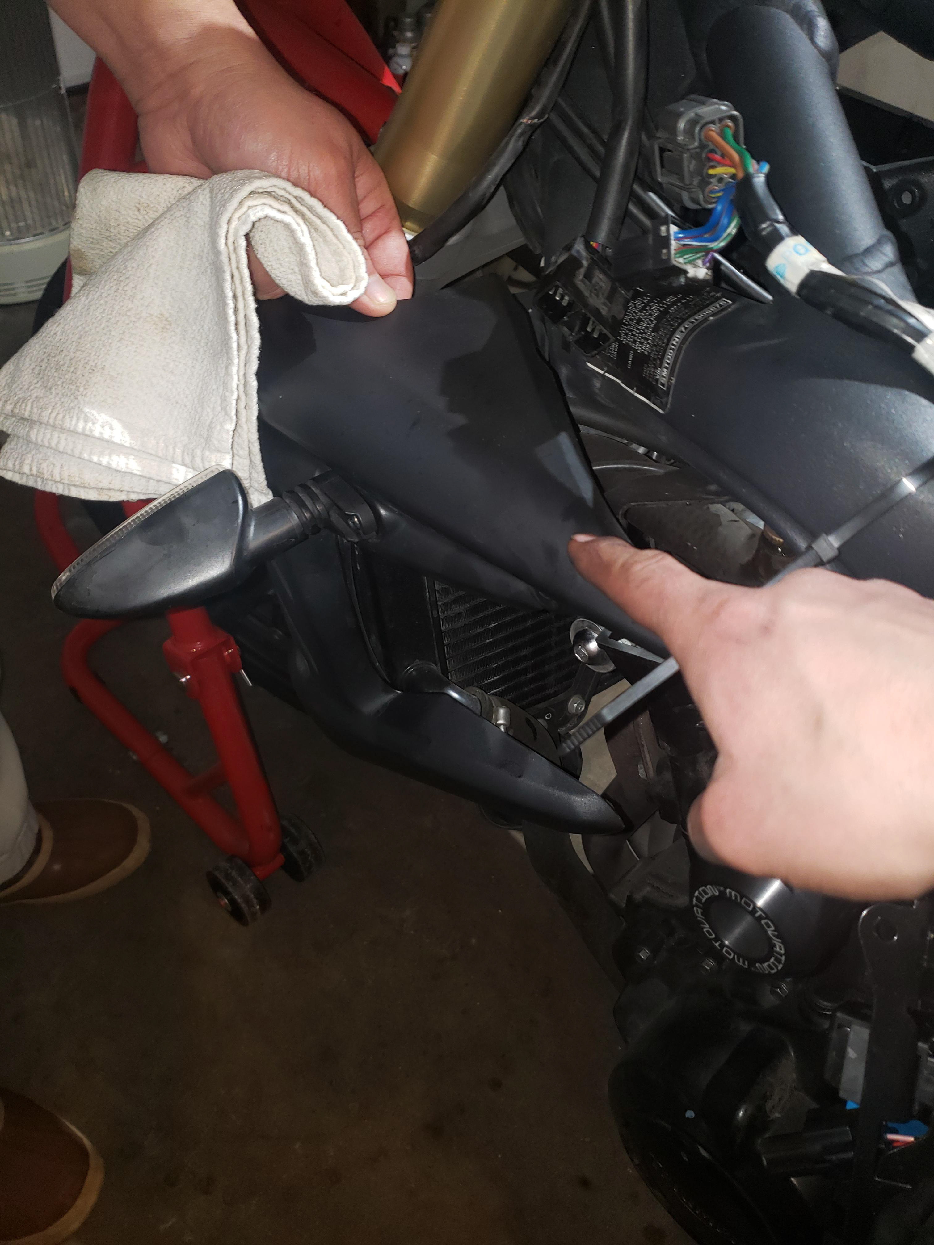 Removing radiator covers, be careful not to damage the turn signal wiring.