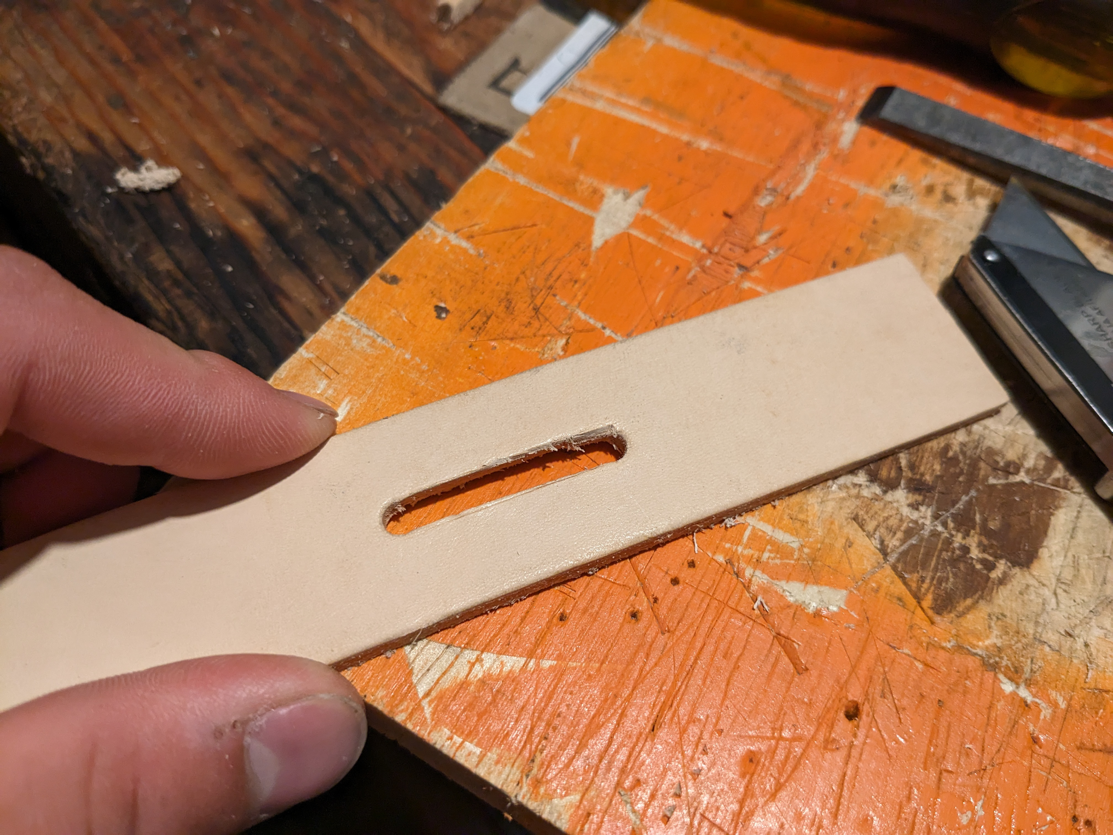 Cutting the slot out where the buckle will go.