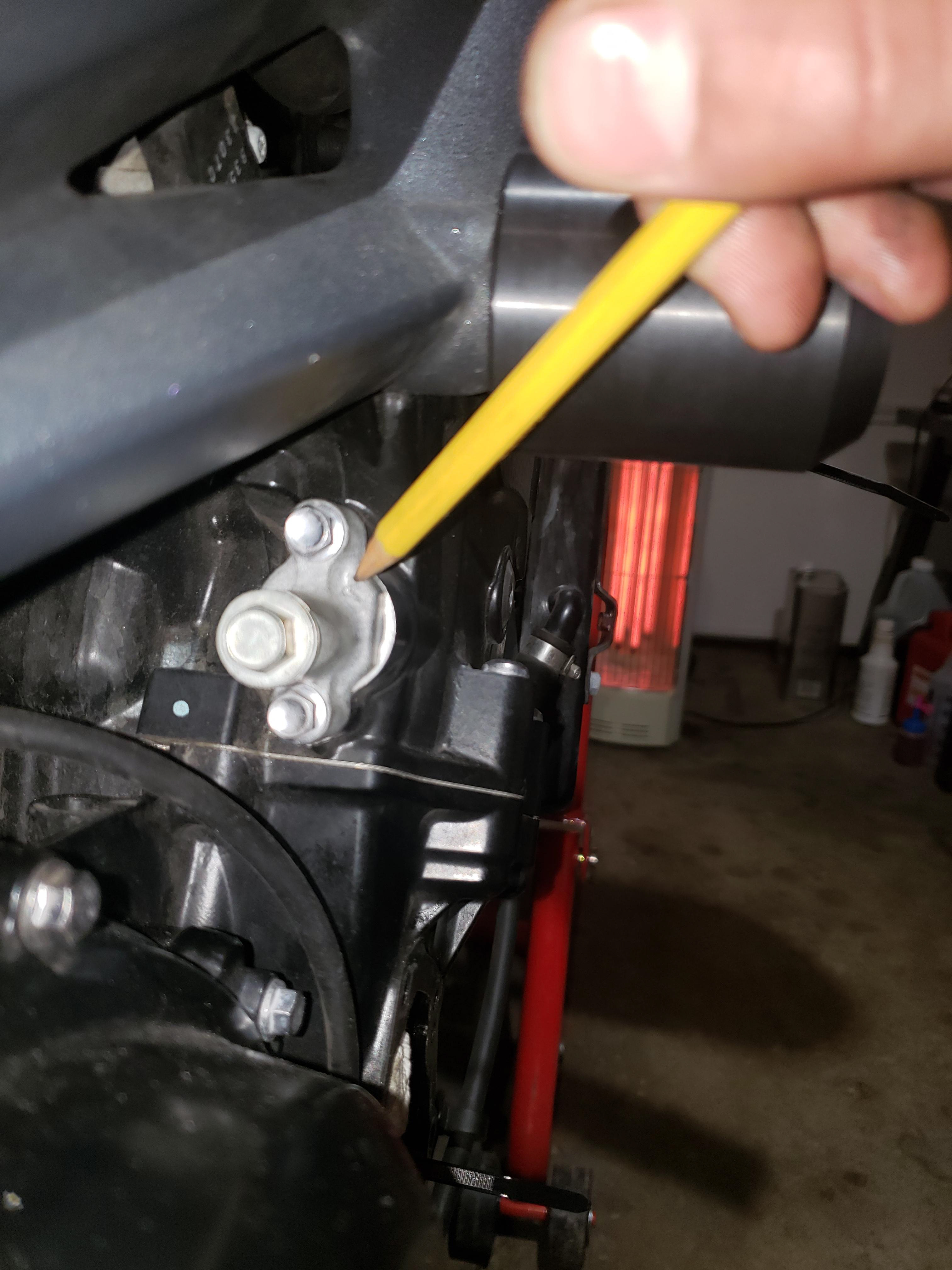 Note orientation of timing chain tensioner.