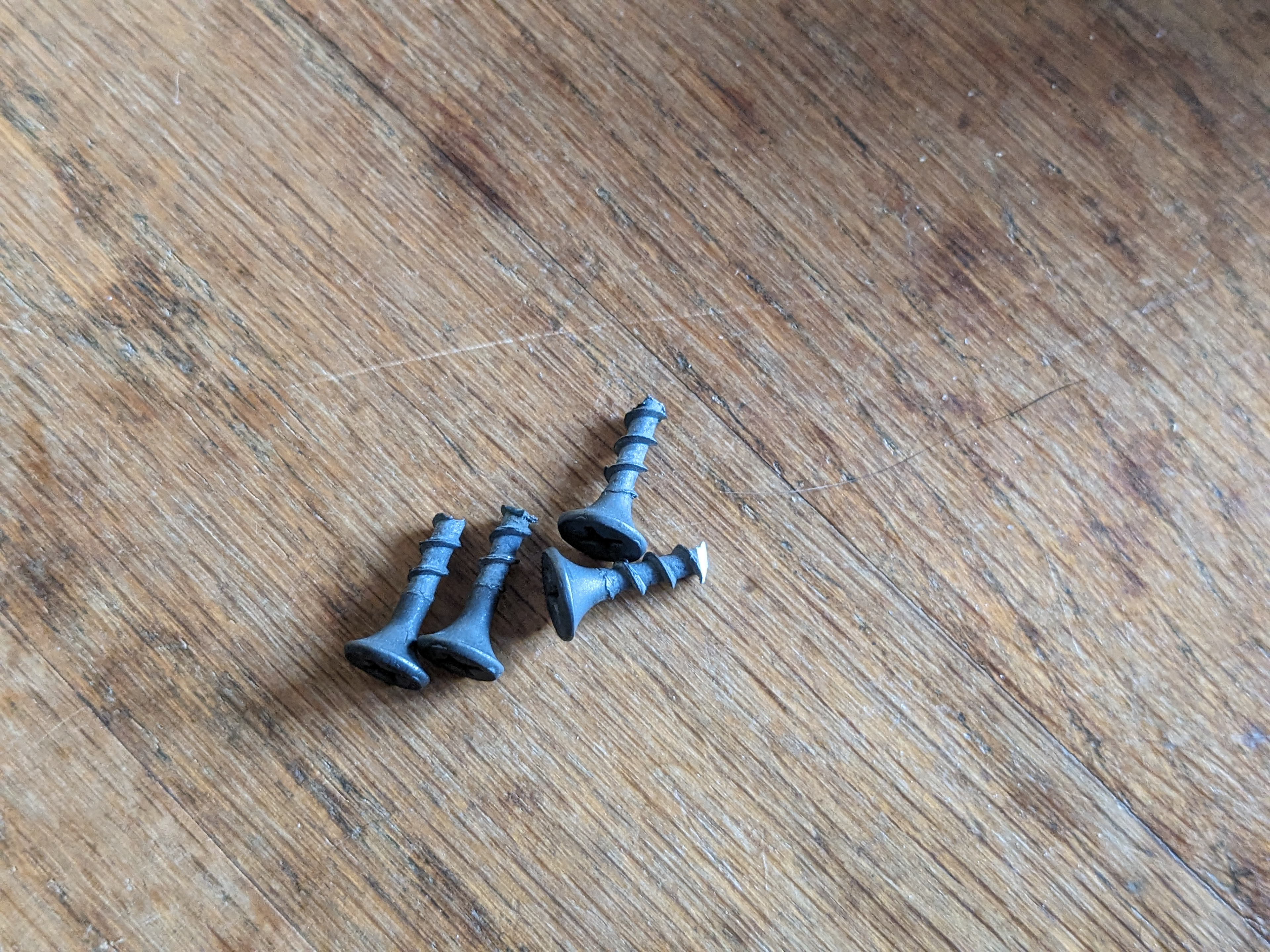 Screws cut short so as to not protrude into the compartment.
