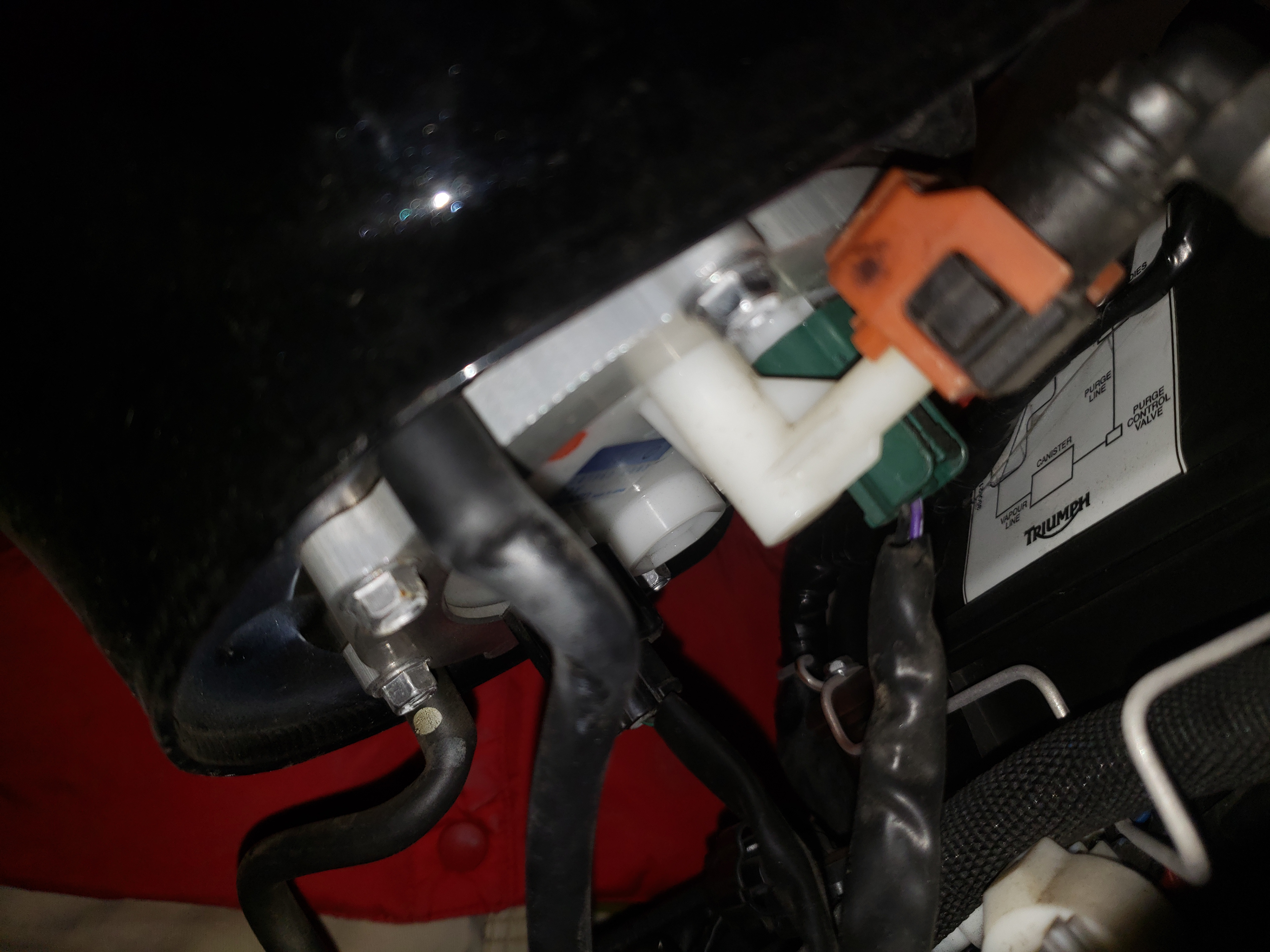 Be very careful, the fuel line connection is fragile.
