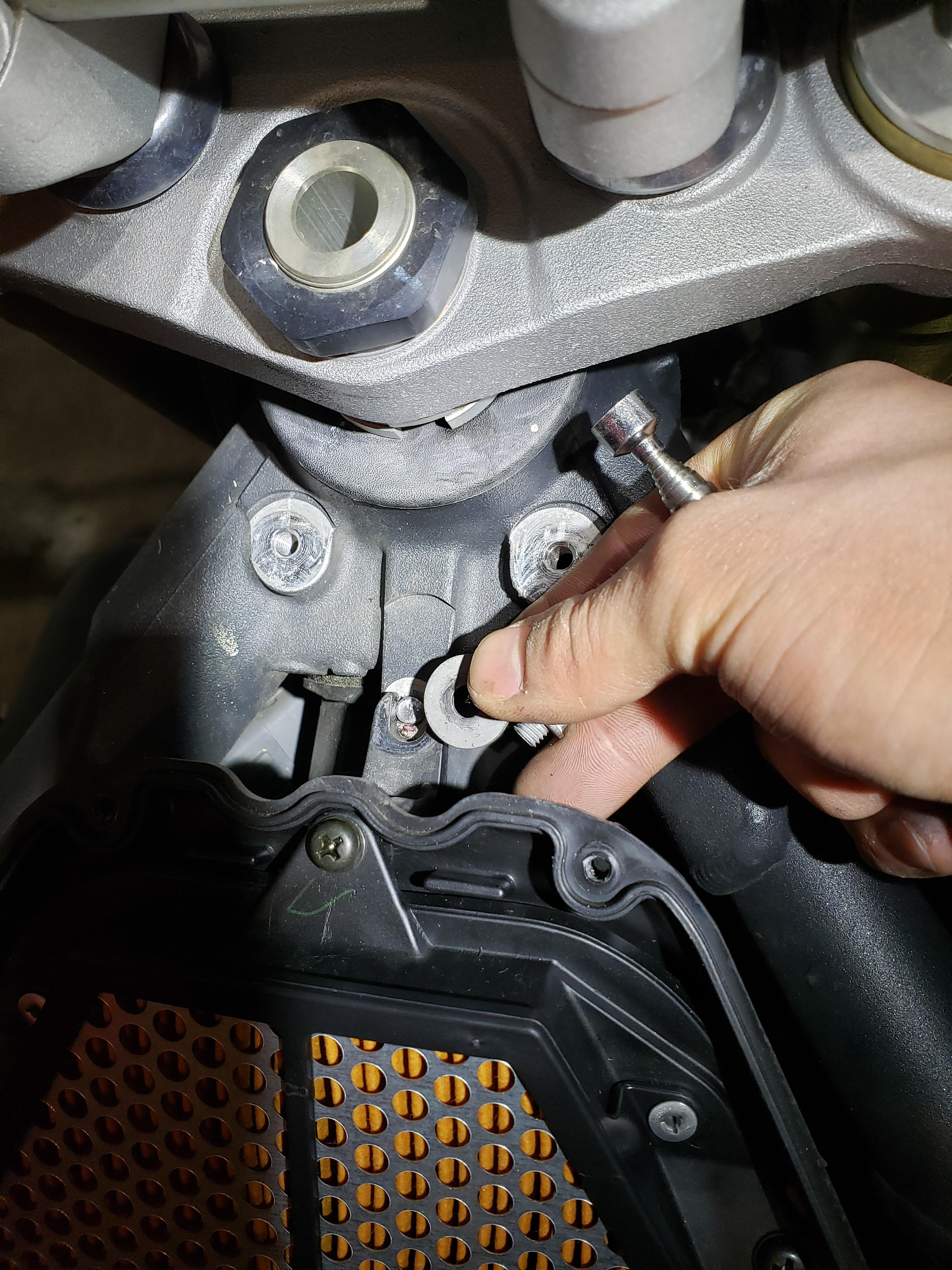 The previous owner overtorqued the front air box holding bolt. The correct torque is quite low.