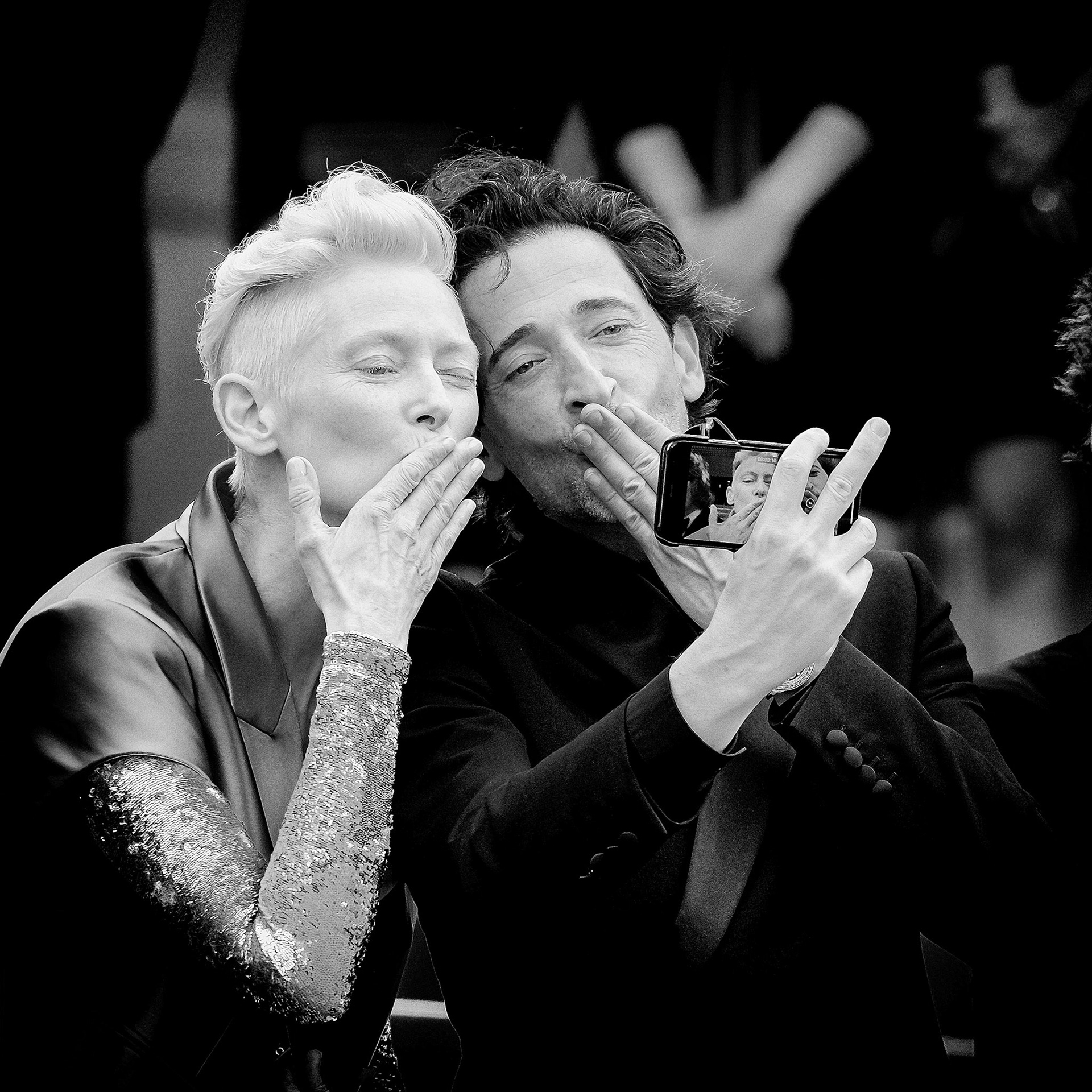 Tilda Swinton and Adrien Brody take a selfie during the "The French Dispatch" Red Carpet during the 74th Cannes International Film Festival on Monday 12 July 2021 at Palais des festivals, Cannes. Editors Note: Image has been converted to Monochrome.  Picture by Julie Edwards/LFI/Avalon. All usages must be credited Julie Edwards/LFI/Avalon.