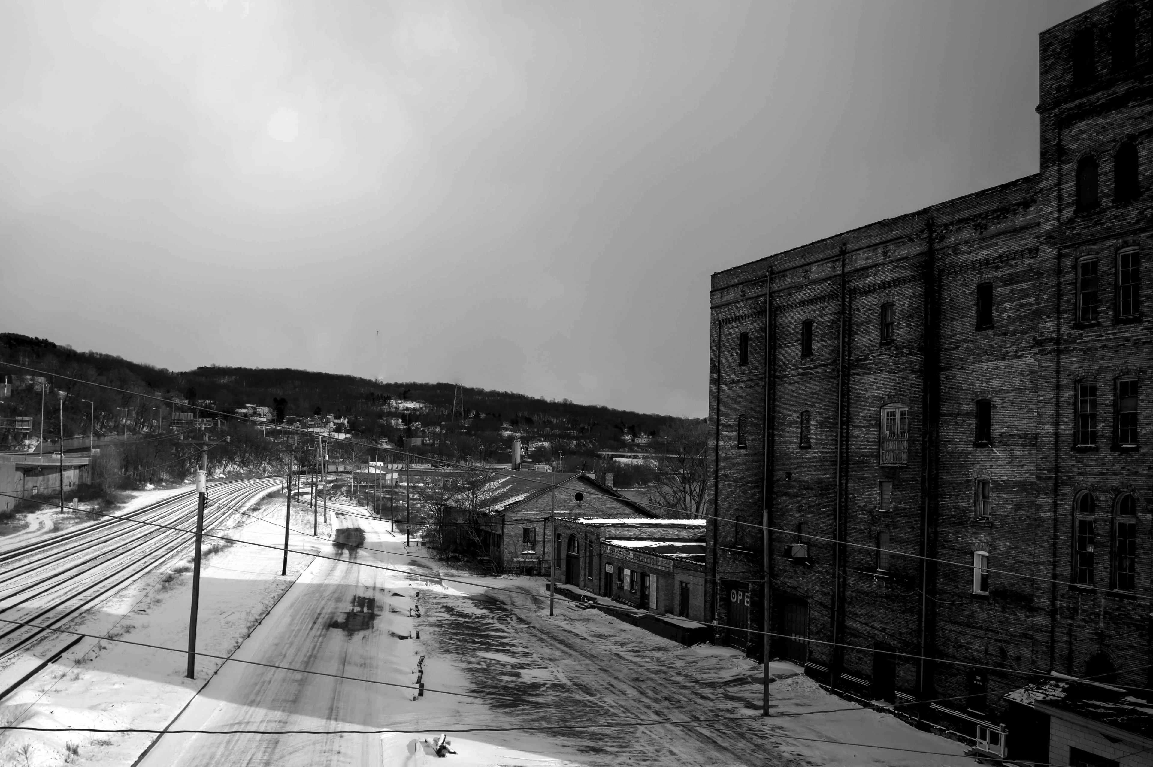 Old bowling alley building and railroad tracks
