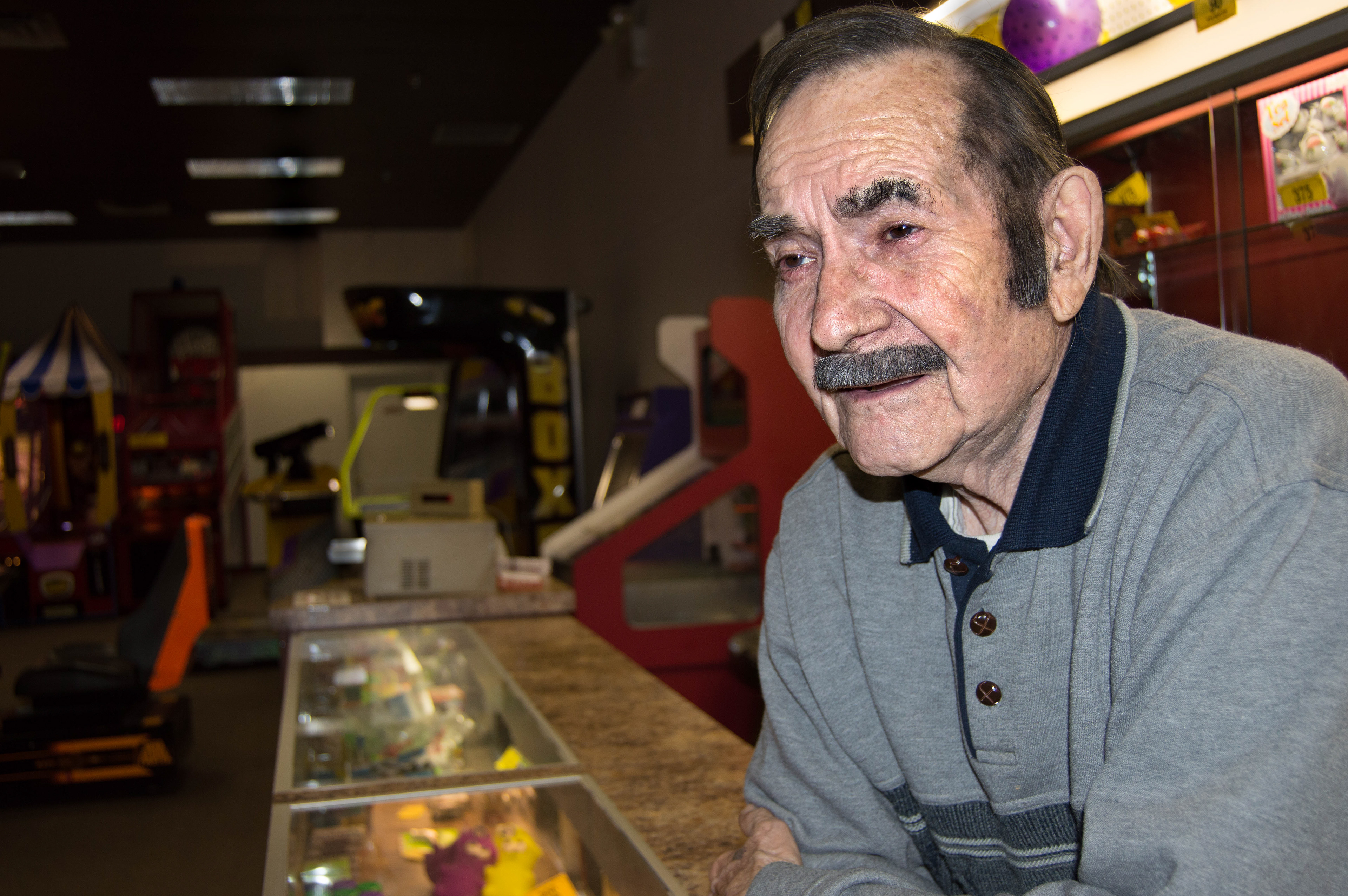 Old man in arcade