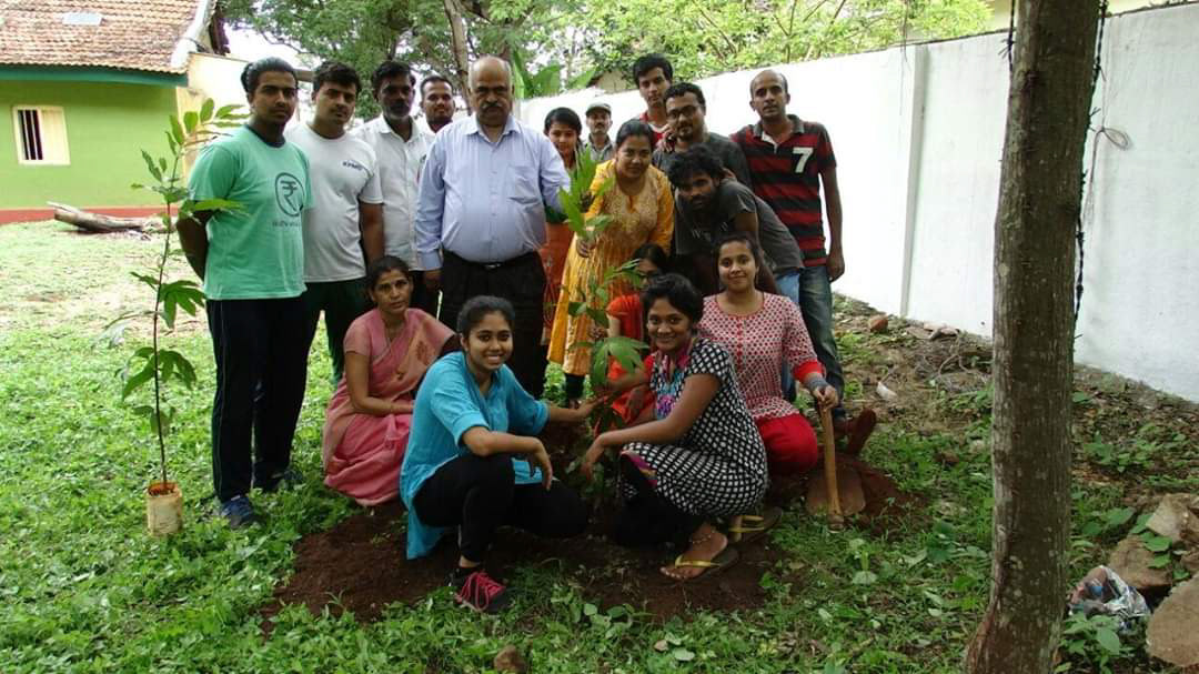 Planting the first among 50 little trees! :)