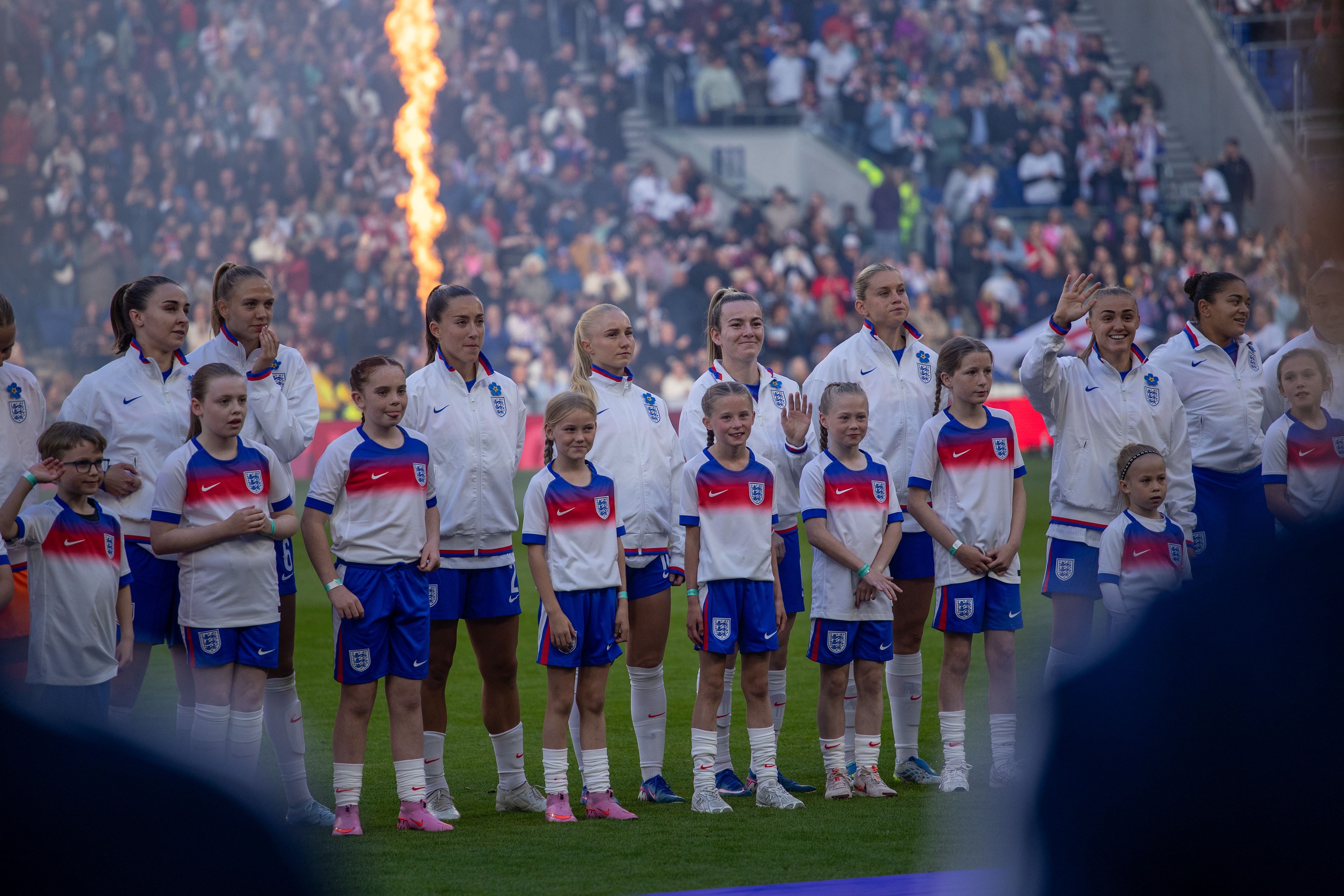 England players with mascots for the national anthem before kick off 