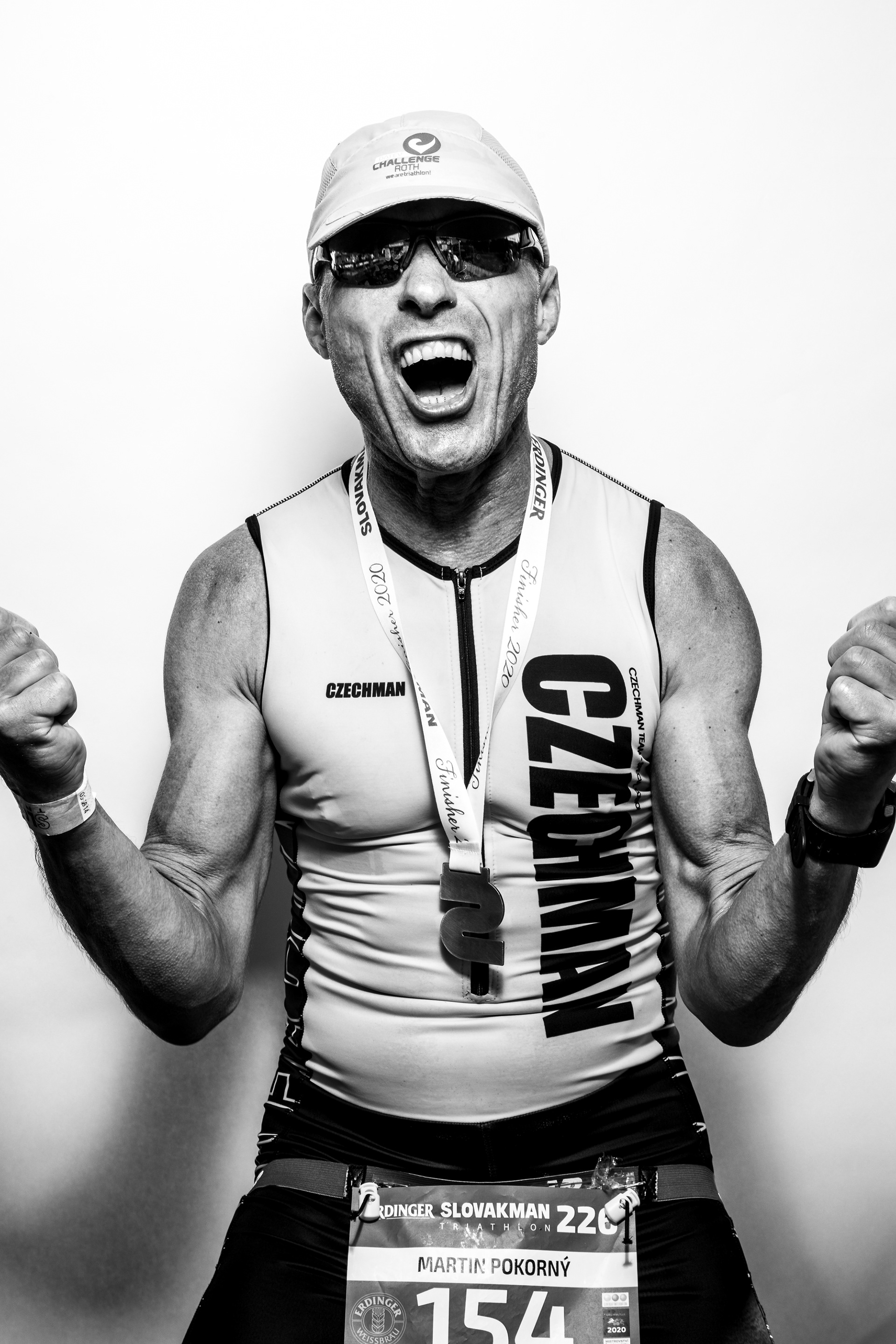 "Face of Endorphines" project - portraits of Ironman triathlon finishers right at the finish line