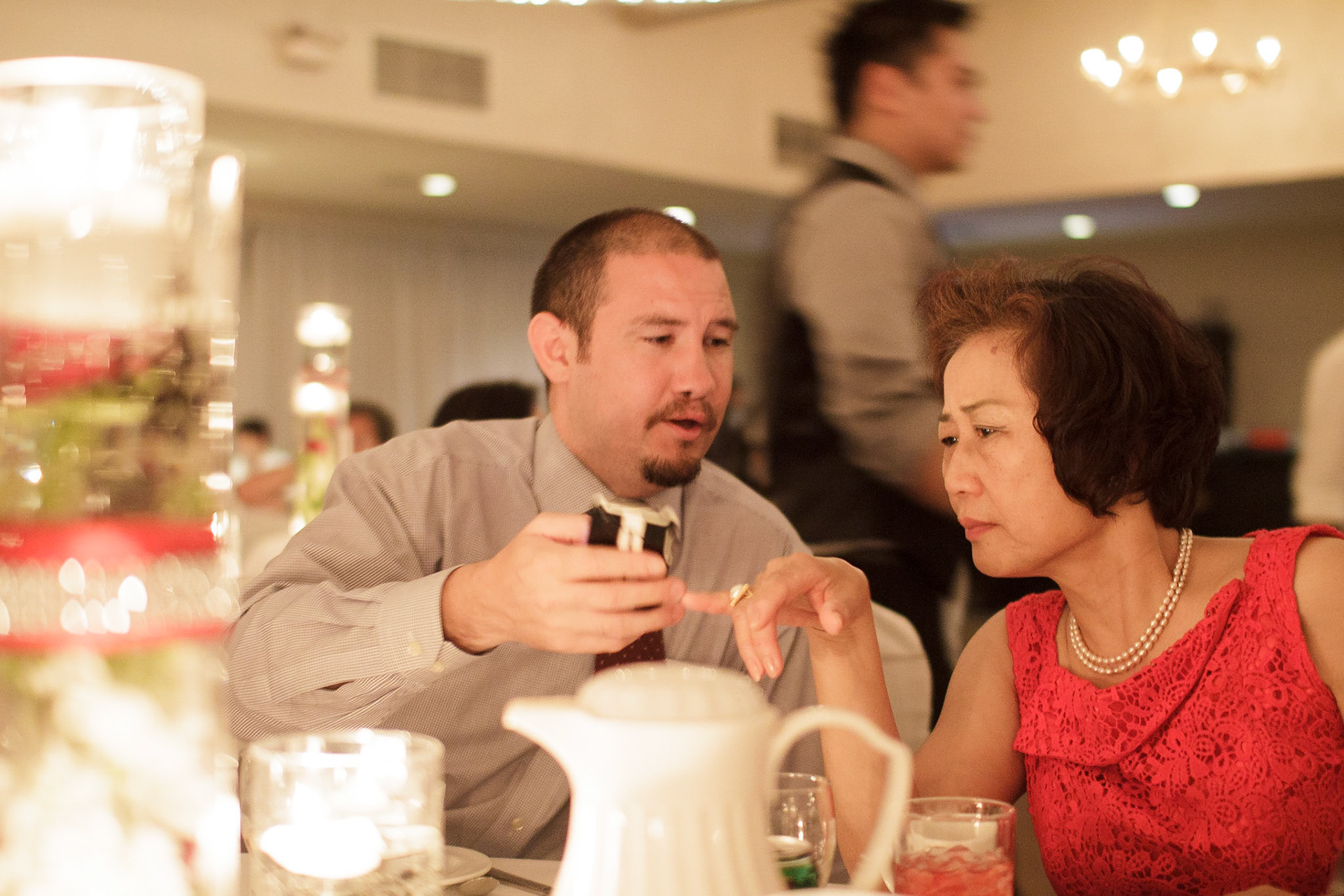 Mike shows his aunt something on his phone