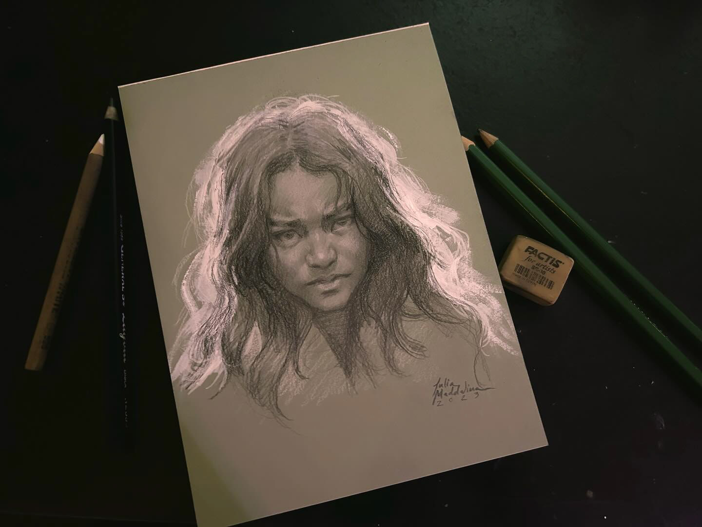 Portrait on sage paper, graphite and white charcoal