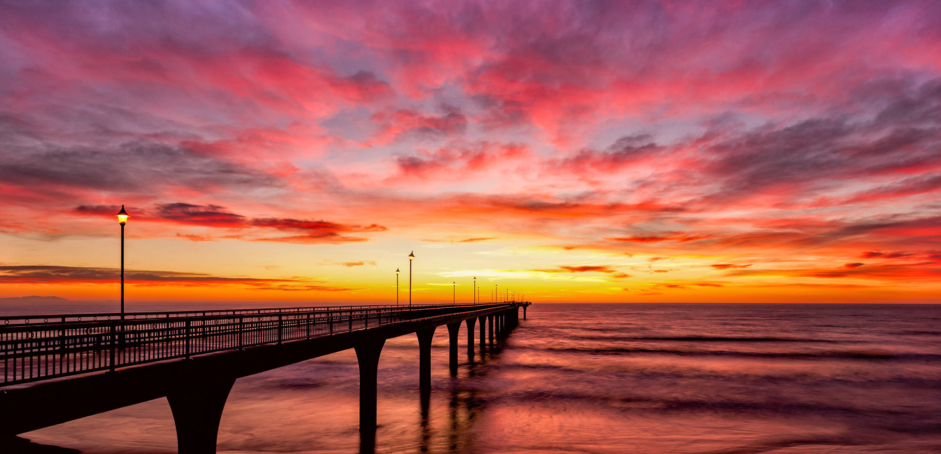 Colorful sunrise at New Brighton Pier, Christchurch.