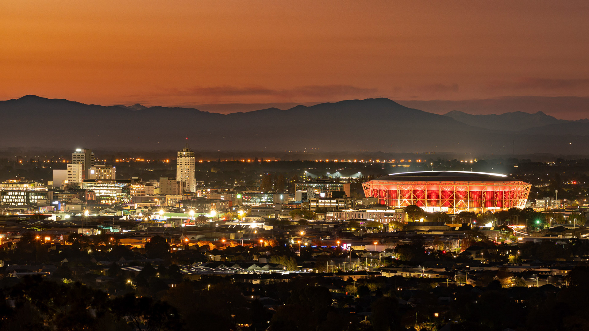 One NZ Stadium at Te Kaha, Christchurch, lit up at sunset for the first Crusaders game. 