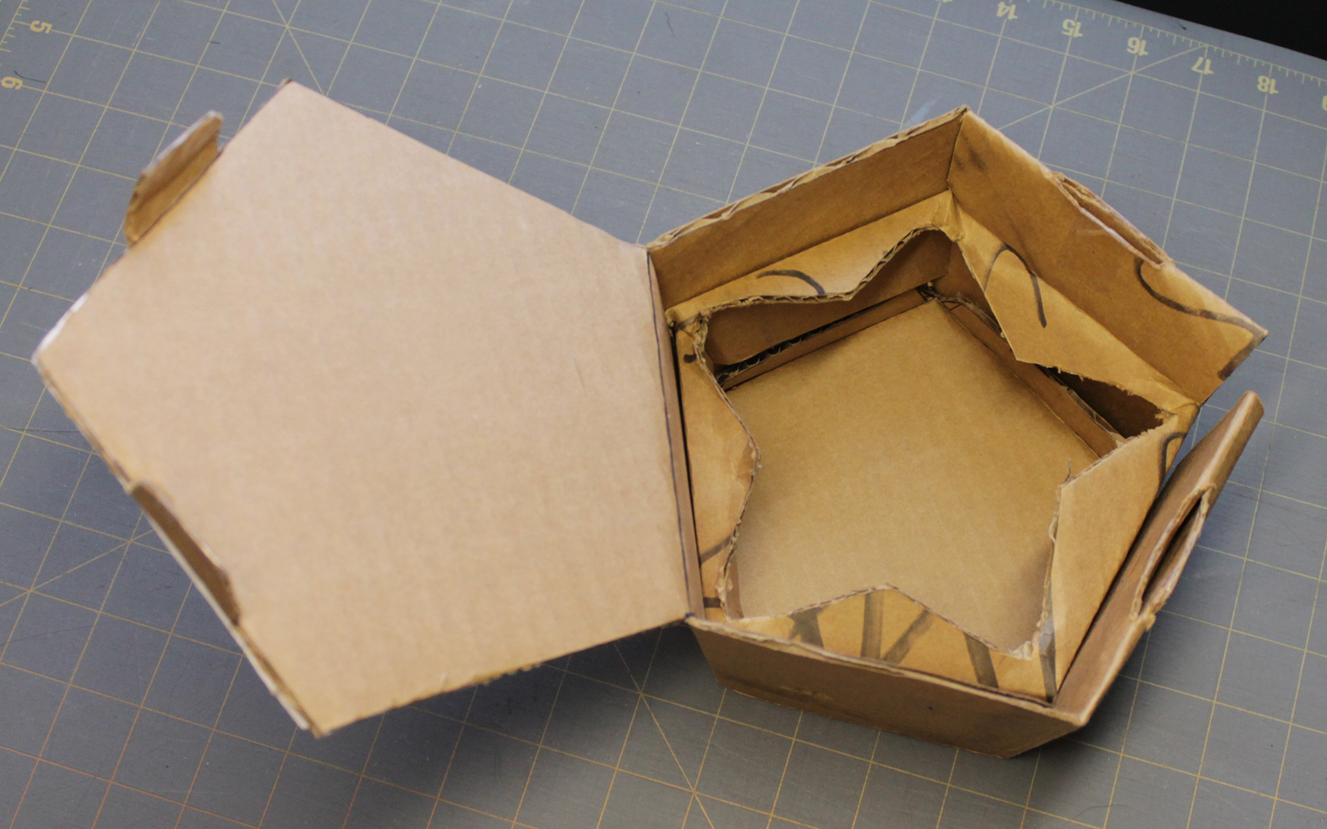 Version 2 was a pentagon with a single hinged door