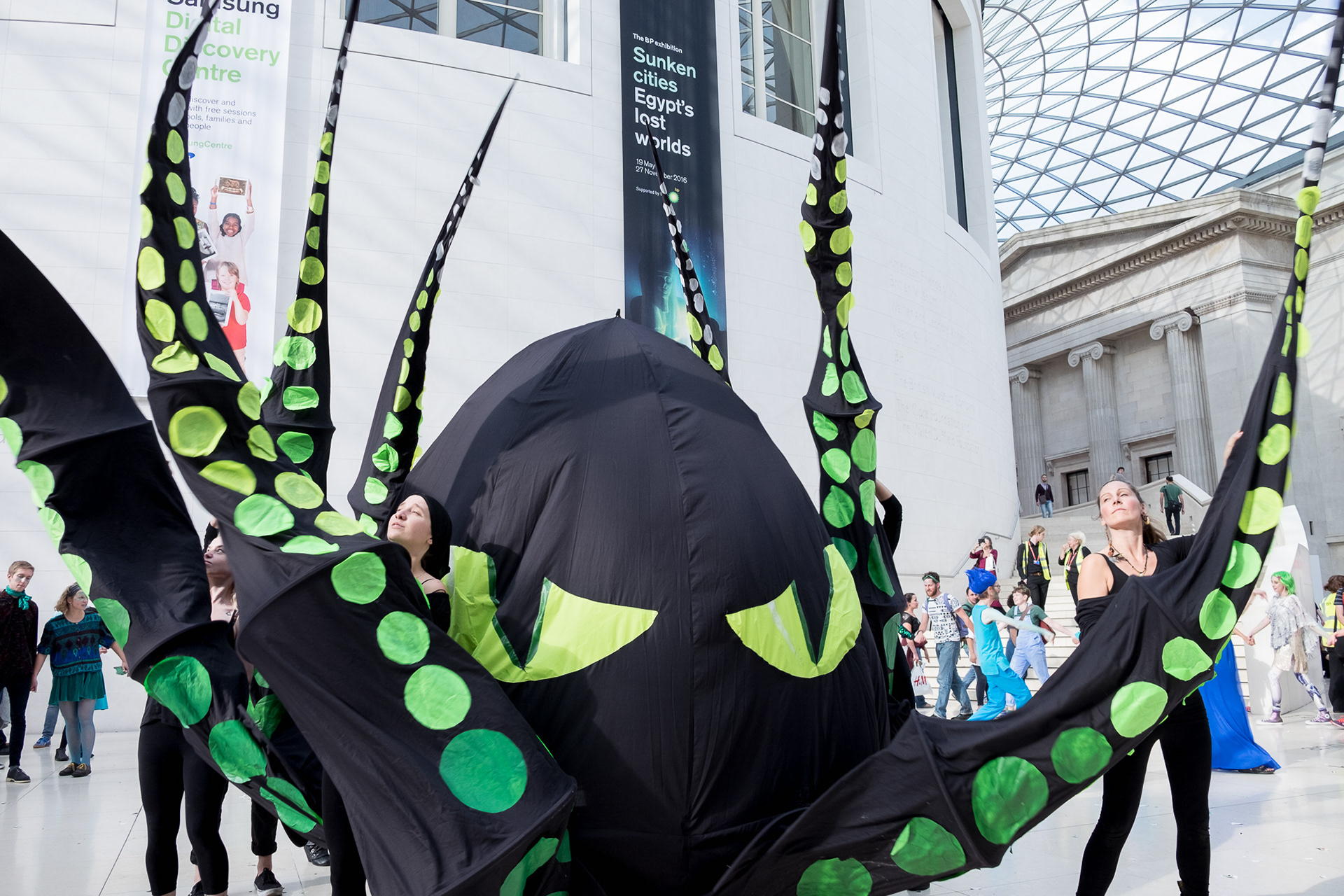 A giant sea monster appears in the British Museum's Great Court during a protest against BP sponsorship