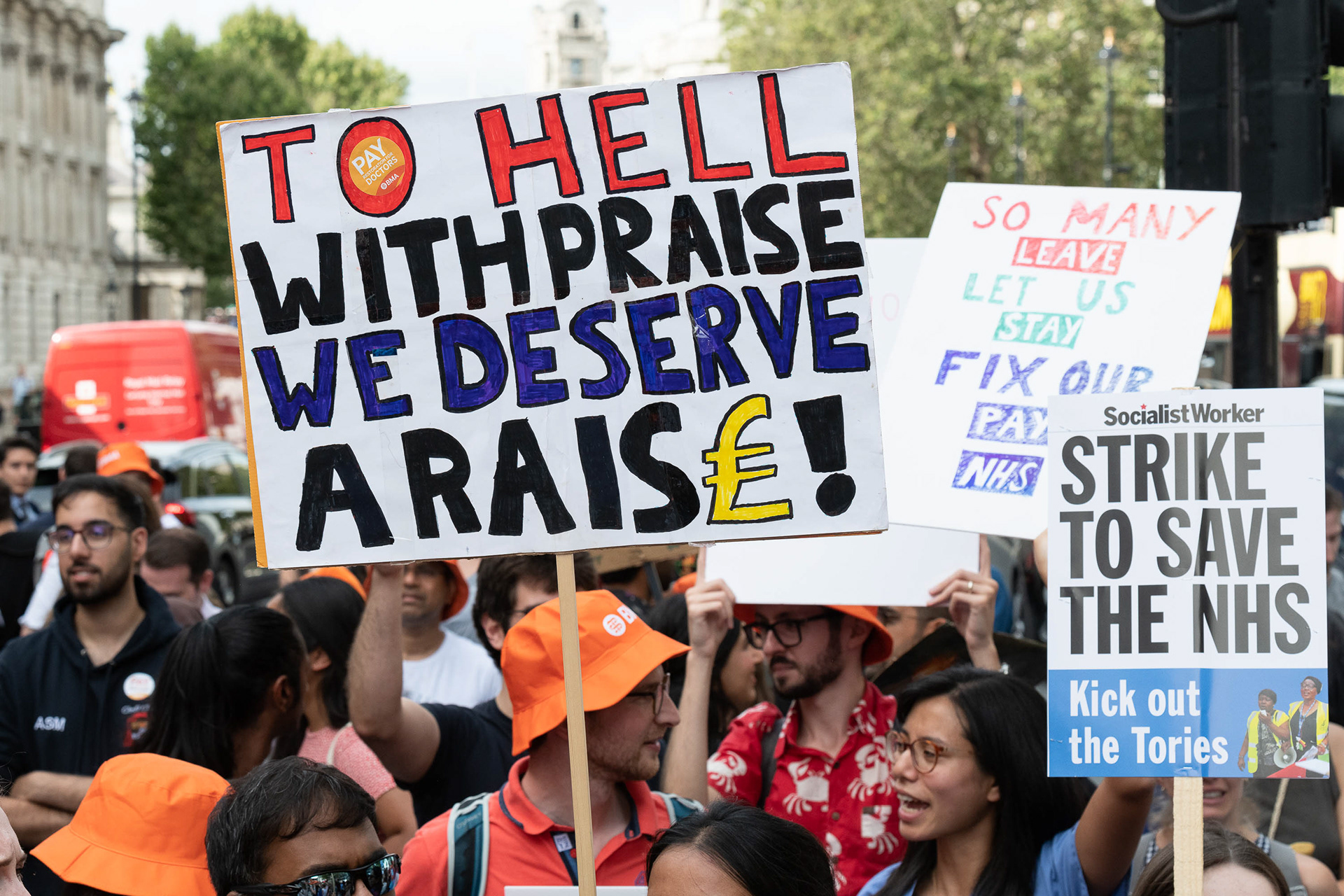 To Hell With Praise We Deserve A Raise placard. © Ron Fassbender