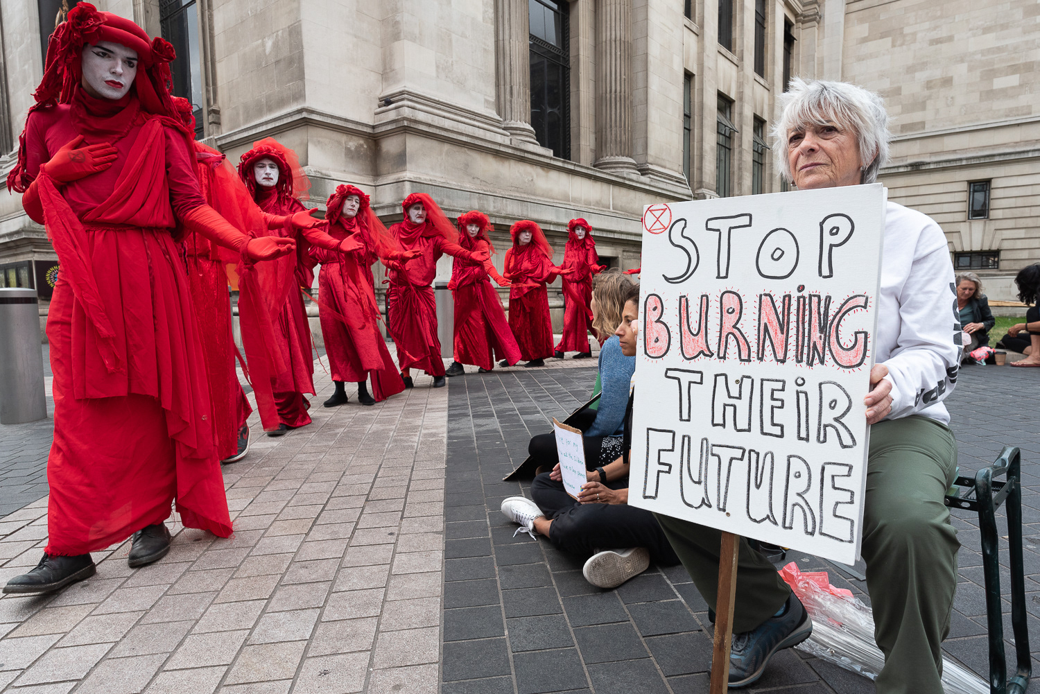 Red Rebels outside the fossil fuel funded Science Museum in London. © Ron Fassbender