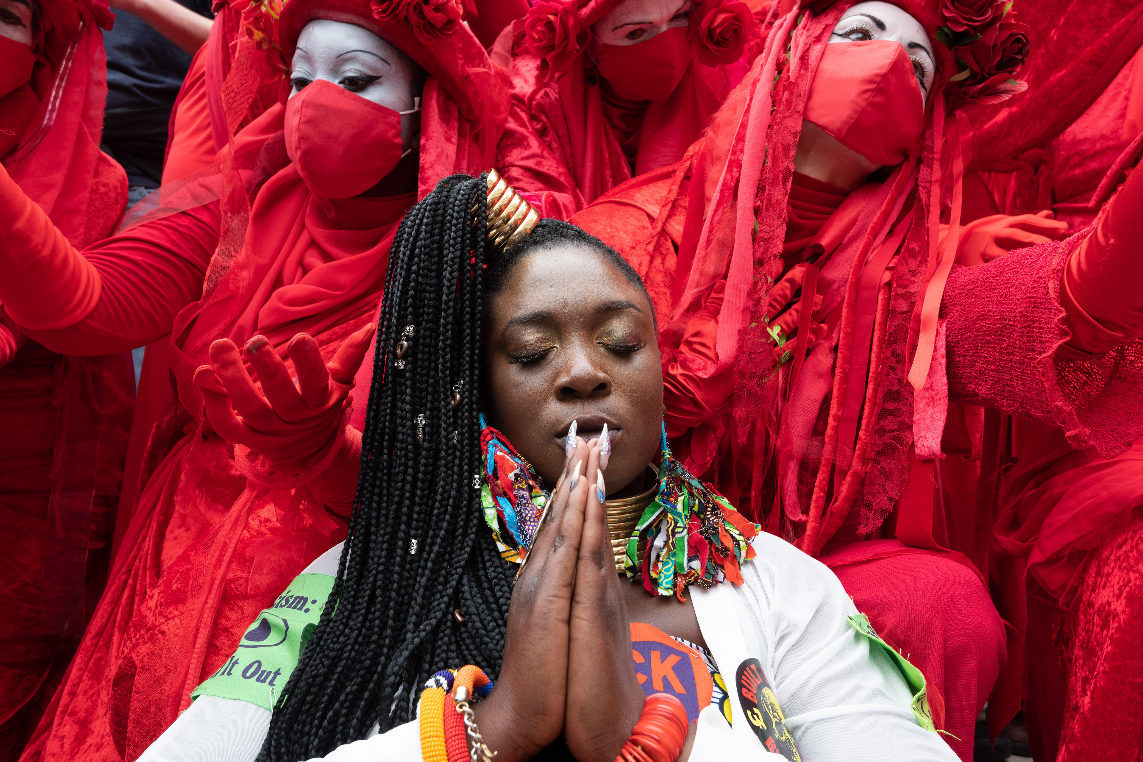 Marvina Newton with the Red Rebel Brigade outside the London Stock Exchange, major financers of fossil fuels. © Ron Fassbender