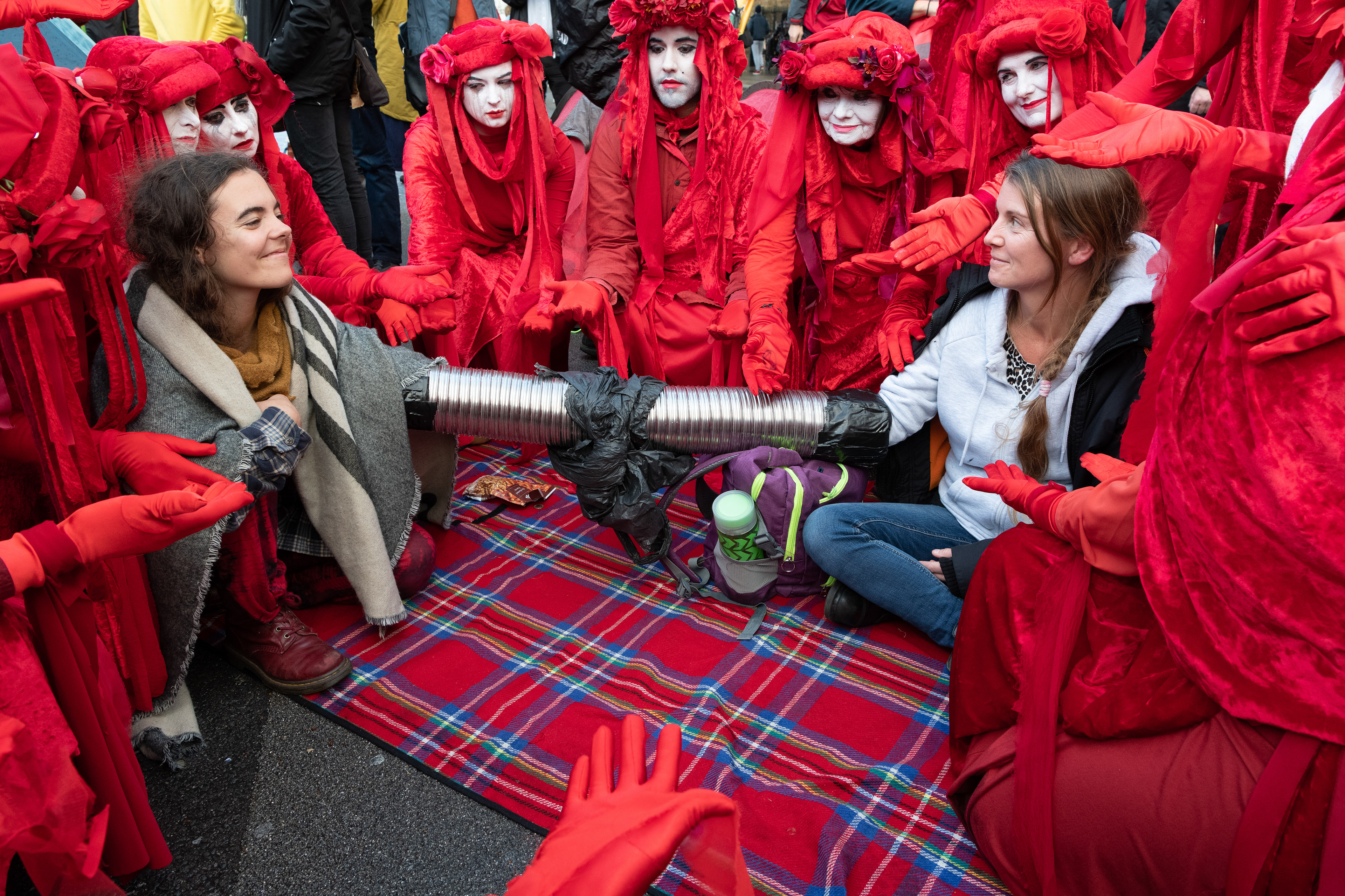 Red Rebel Brigade support locked-on activists in Whitehall awaiting arrest. © Ron Fassbender