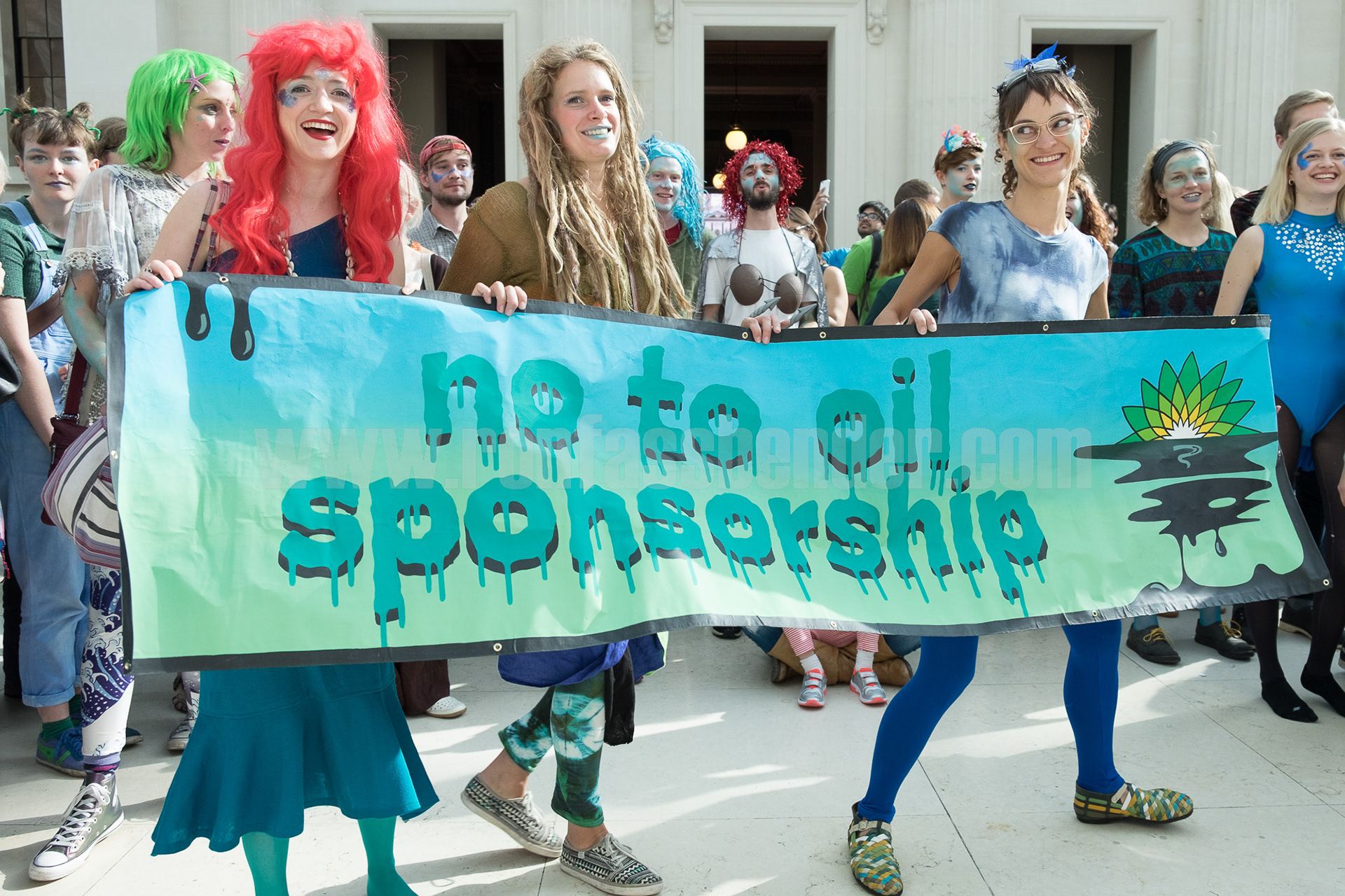 Activists hold a "No To Oil Sponsorship" banner in the British Museum's Great Court. © Ron Fassbender 