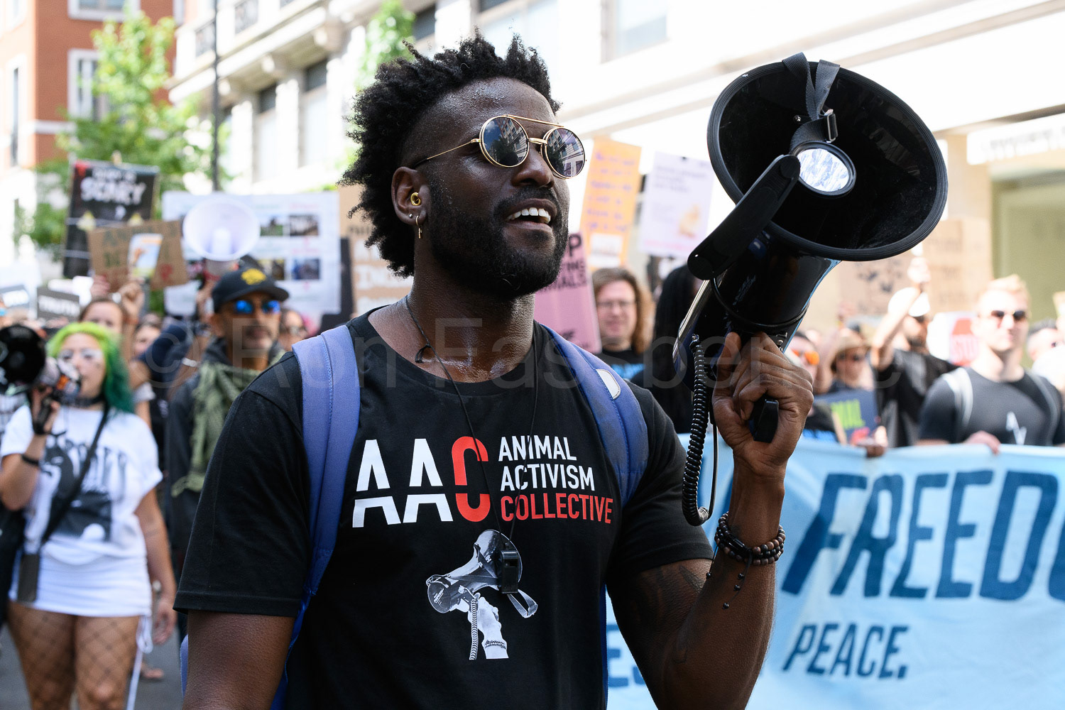 A man with a megaphone at the front of the National Animal Rights March in London 2026