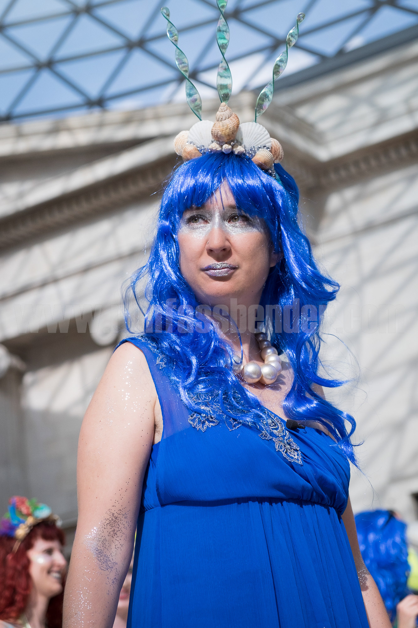 An activist dressed as a mermaid during a performance protest against sponsorship of the British Museum's 'Sunken Cities' exhibition by oil company BP. © Ron Fassbender