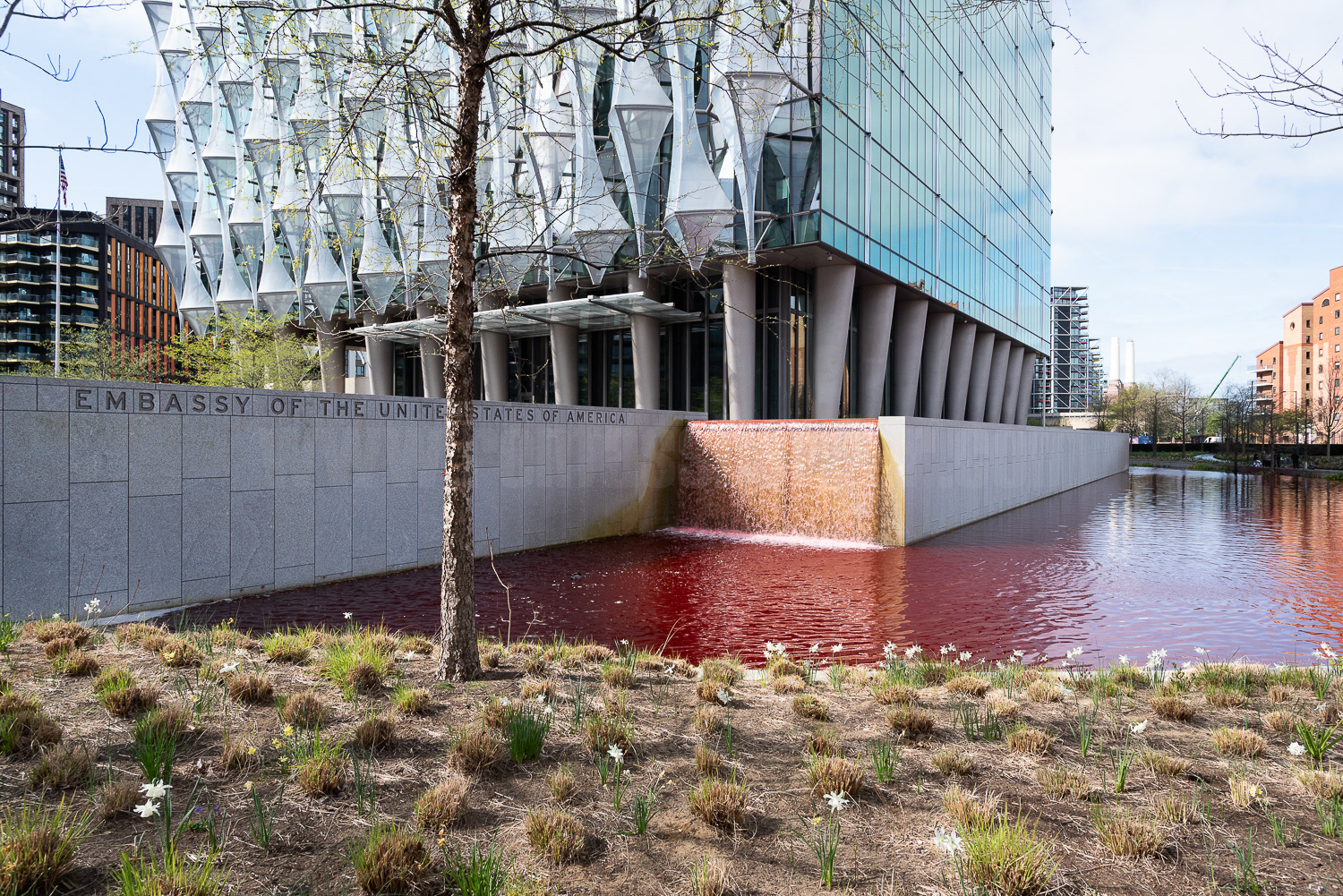 The US Embassy pond and waterfall filled with red dye in protest at arms sales to Israel. © Ron Fassbender