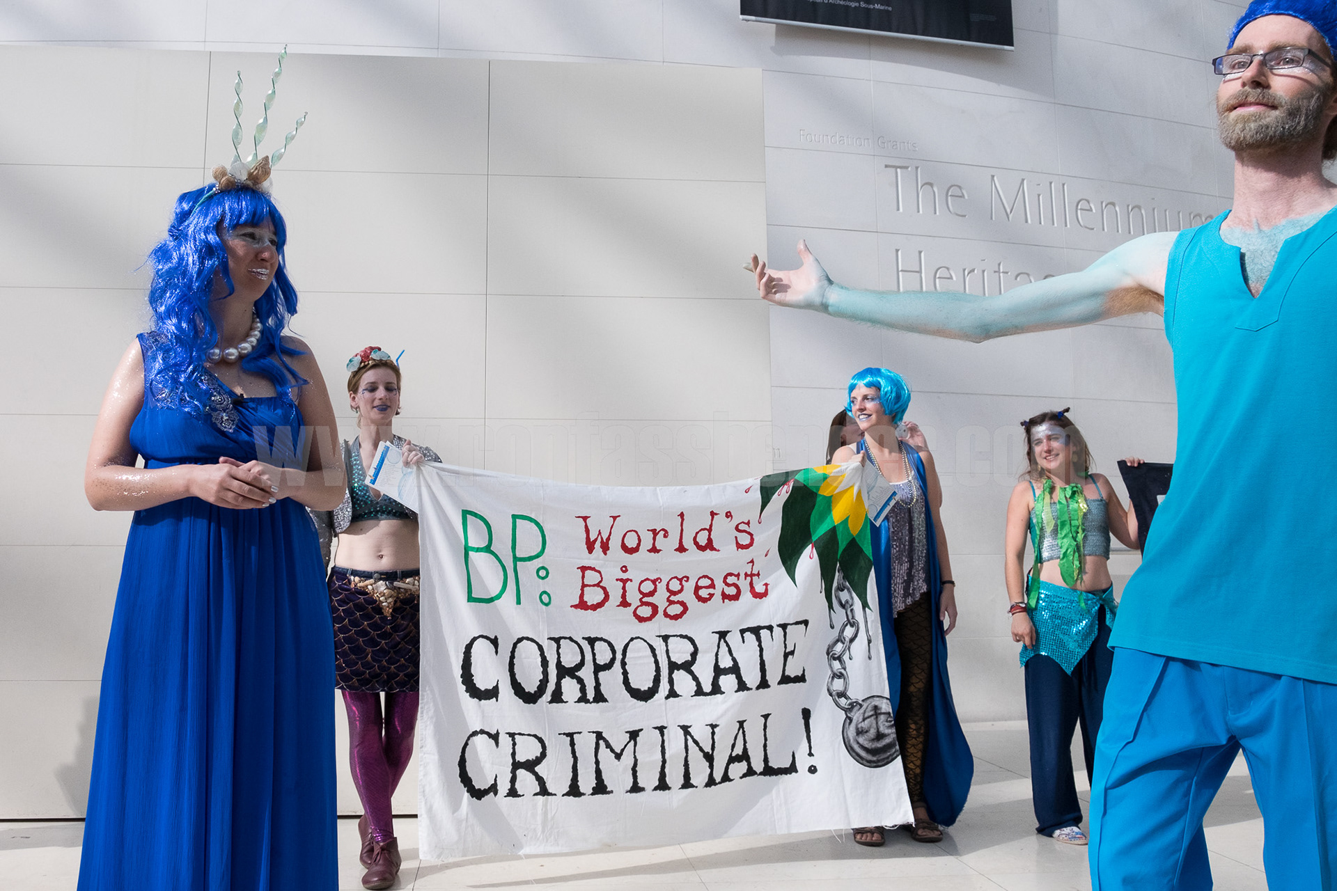Activists hold a banner proclaiming oil company BP a "corporate criminal" while protesting BP sponsorship of the British Museum. © Ron Fassbender 
