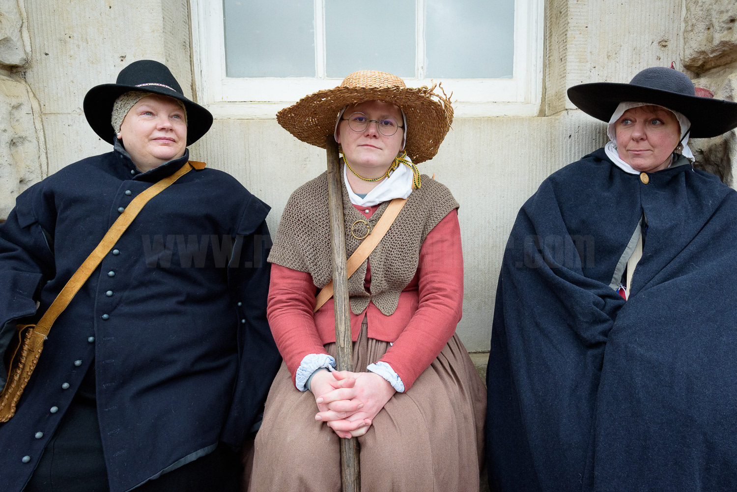  Women in period costume take a break © Ron Fassbender