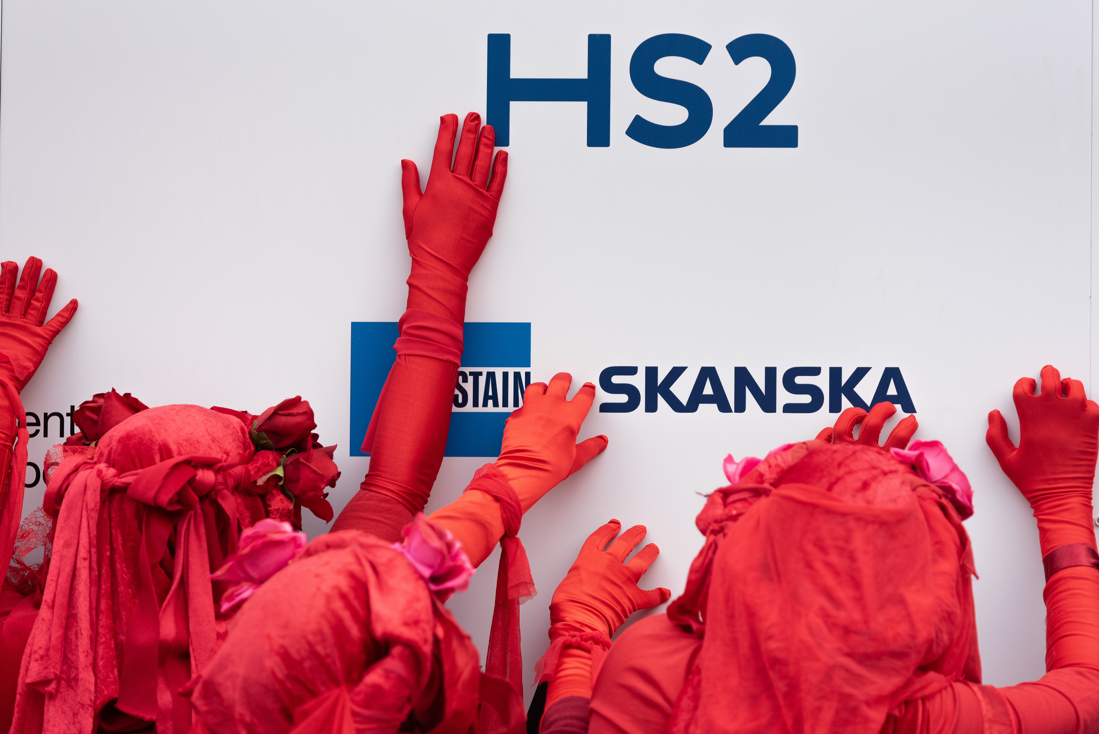 Red Rebel Brigade join a Stop HS2 action at Euston Station. © Ron Fassbender