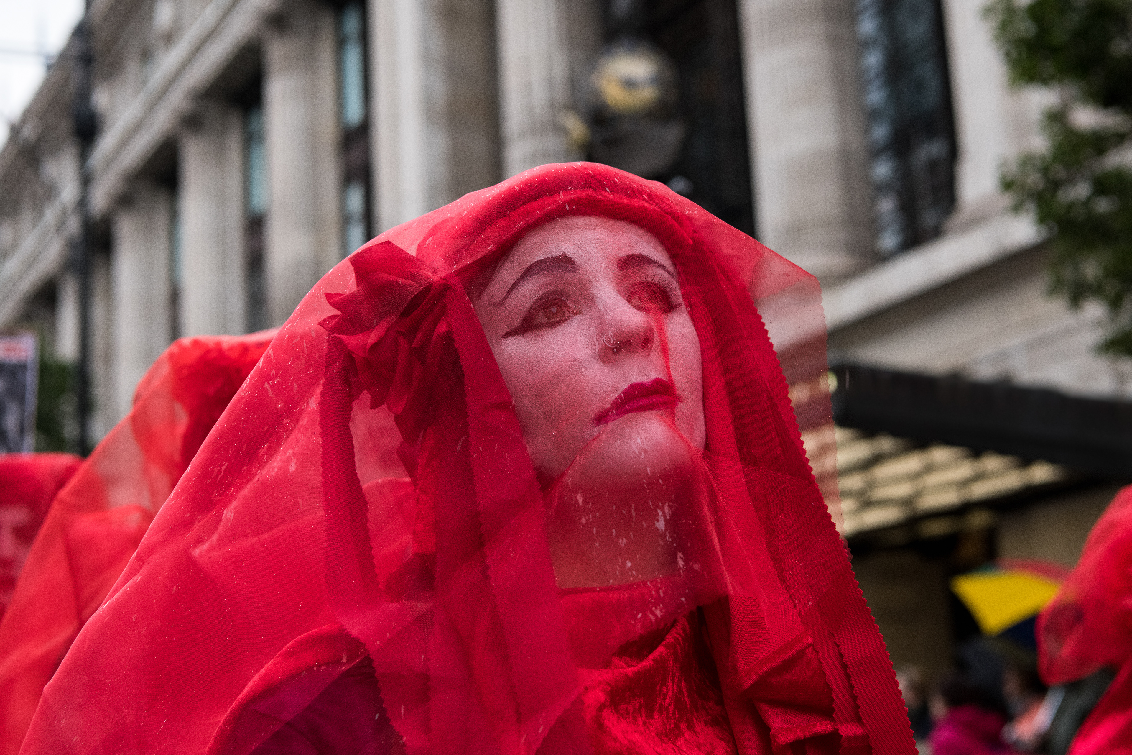 Red Rebel Brigade in a very wet Oxford Street. © Ron Fassbender