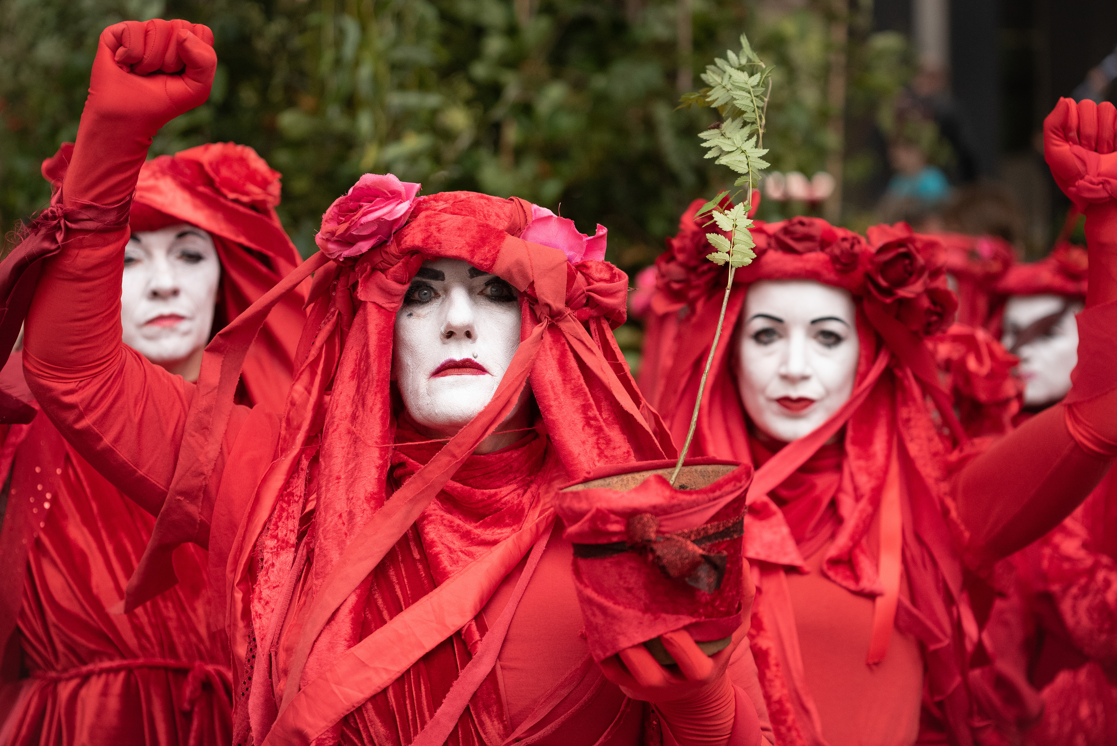Red Rebel Brigade delivering a tree sapling to replace trees lost to the HS2 rail scheme. © Ron Fassbender