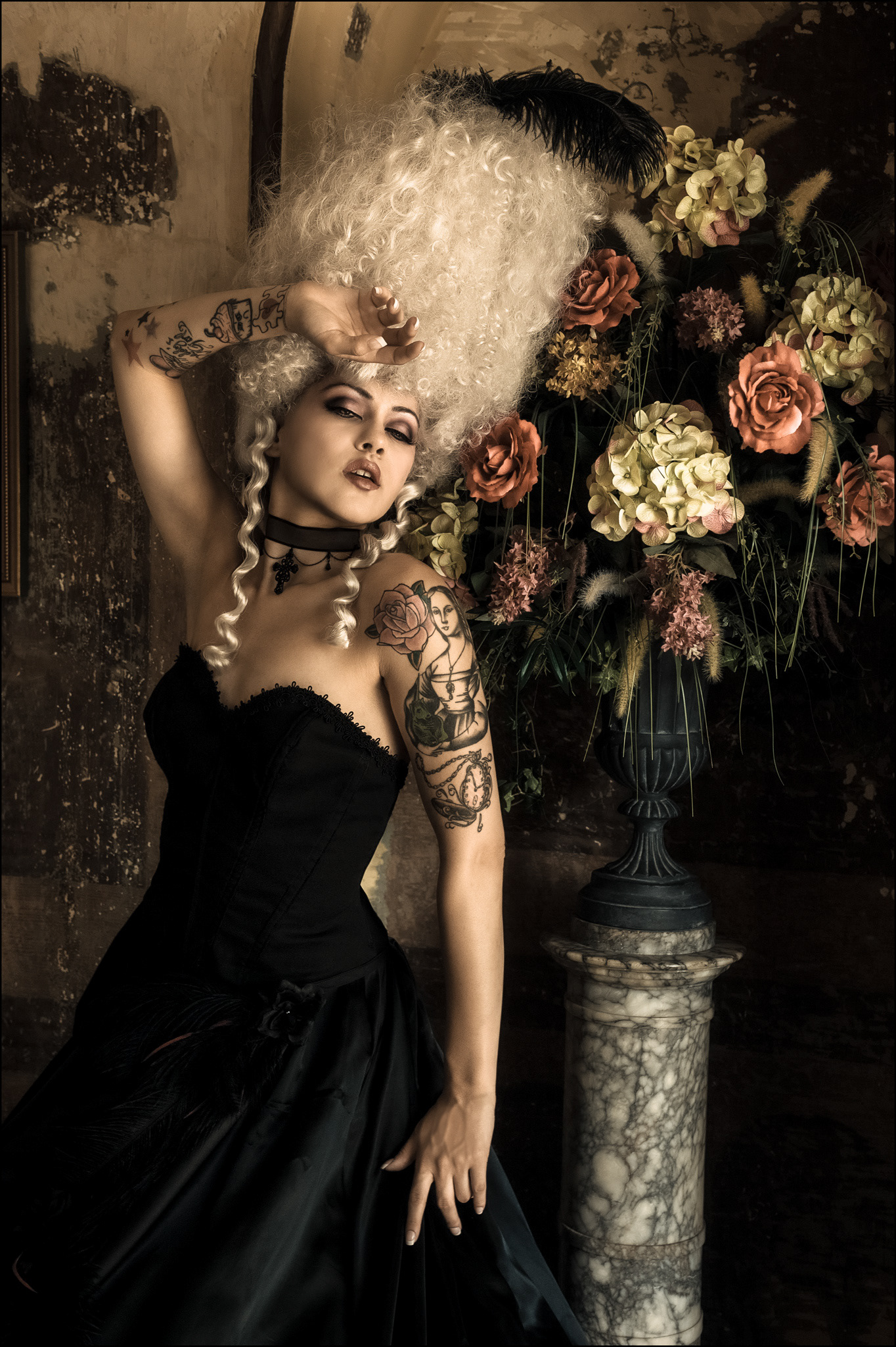 Editorial portrait of a woman in a Marie Antoinette style wig with cinematic lighting