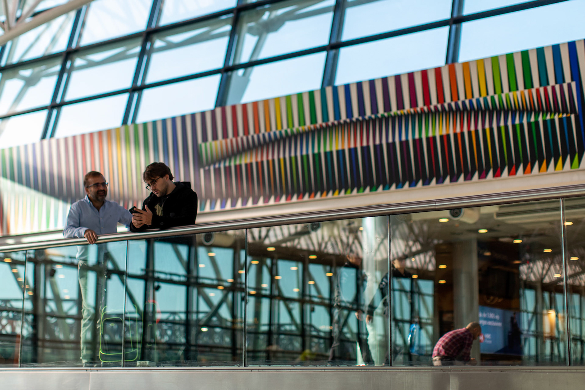 In this April 4, 2019, photo, Tomás Ruiz, 27, chats with his father, Pablo Ruiz, at the International Airport Ministro Pistarini, in Ezeiza, Buenos Aires, Argentina. Before moving to Dublin, Ireland in search of work.