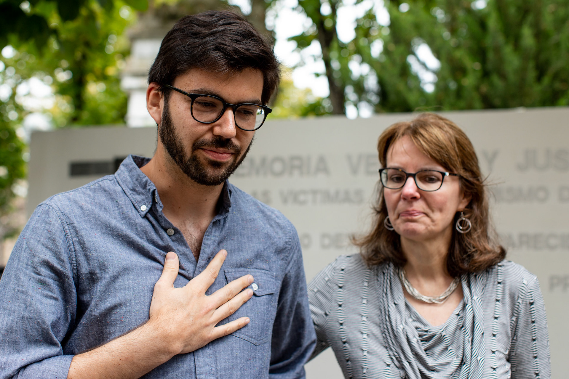 Bonnie Loedel and her brother Daniel Loedel talk at their sister Isabel Celia Loedel Maiztegui inhumation at the La Plata Cementery in the city of La Plata, Buenos Aires.