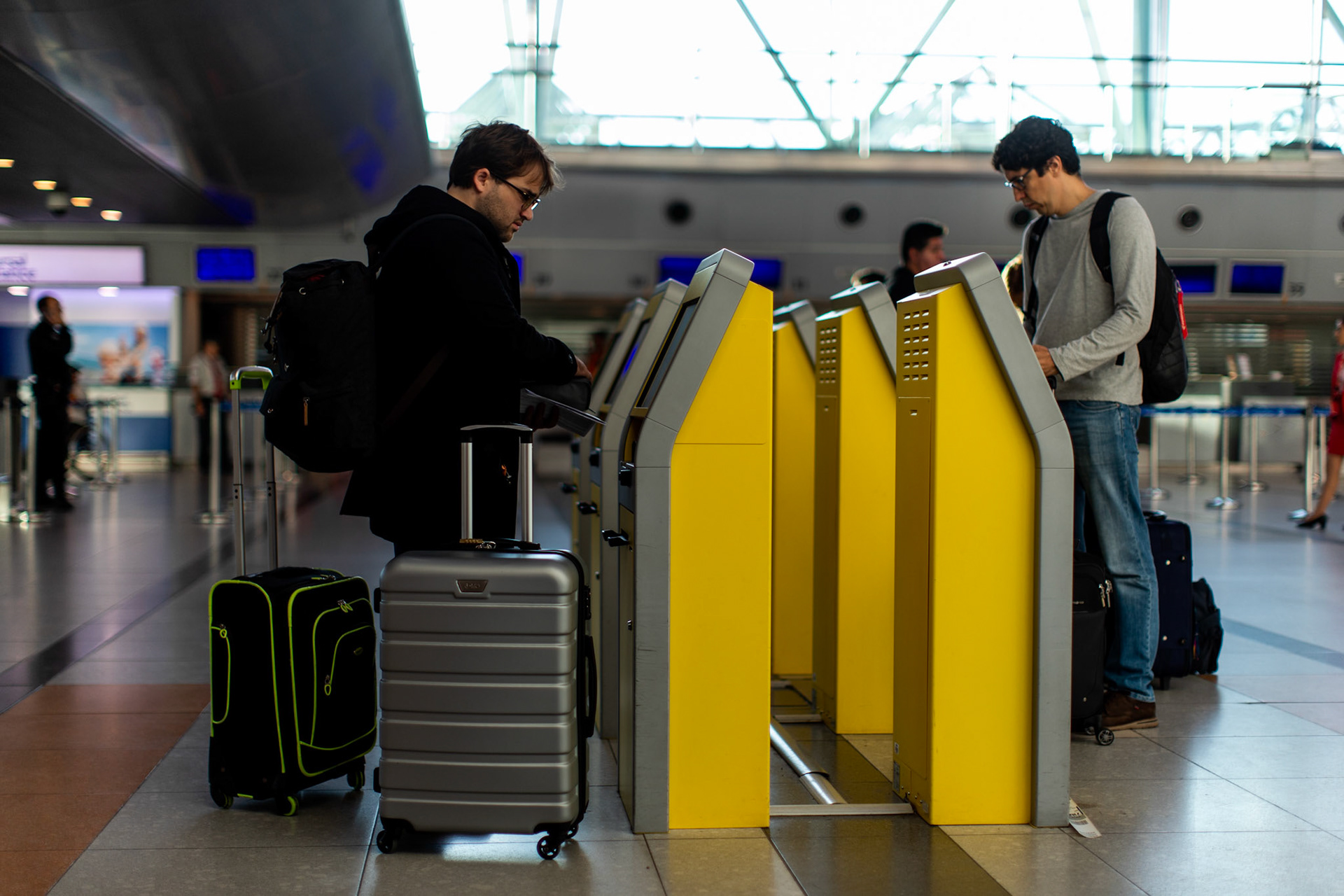 In this April 4, 2019, photo, Tomás Ruiz, 27, checks in at the International Airport Ministro Pistarini, in Ezeiza, Buenos Aires. Before moving to Dublin, Ireland in search of work.