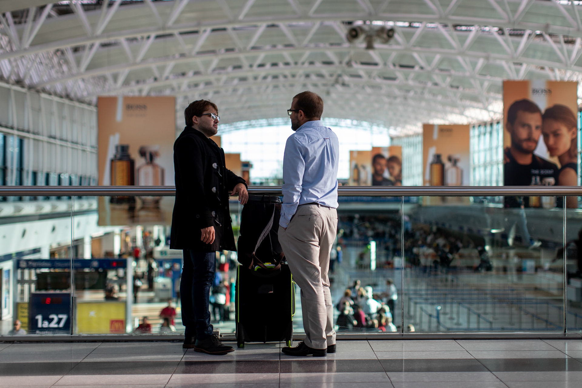 In this April 4, 2019, photo, Tomás Ruiz, 27, chats with his father, Pablo Ruiz, at the International Airport Ministro Pistarini, in Ezeiza, Buenos Aires, Argentina. Before moving to Dublin, Ireland in search of work.