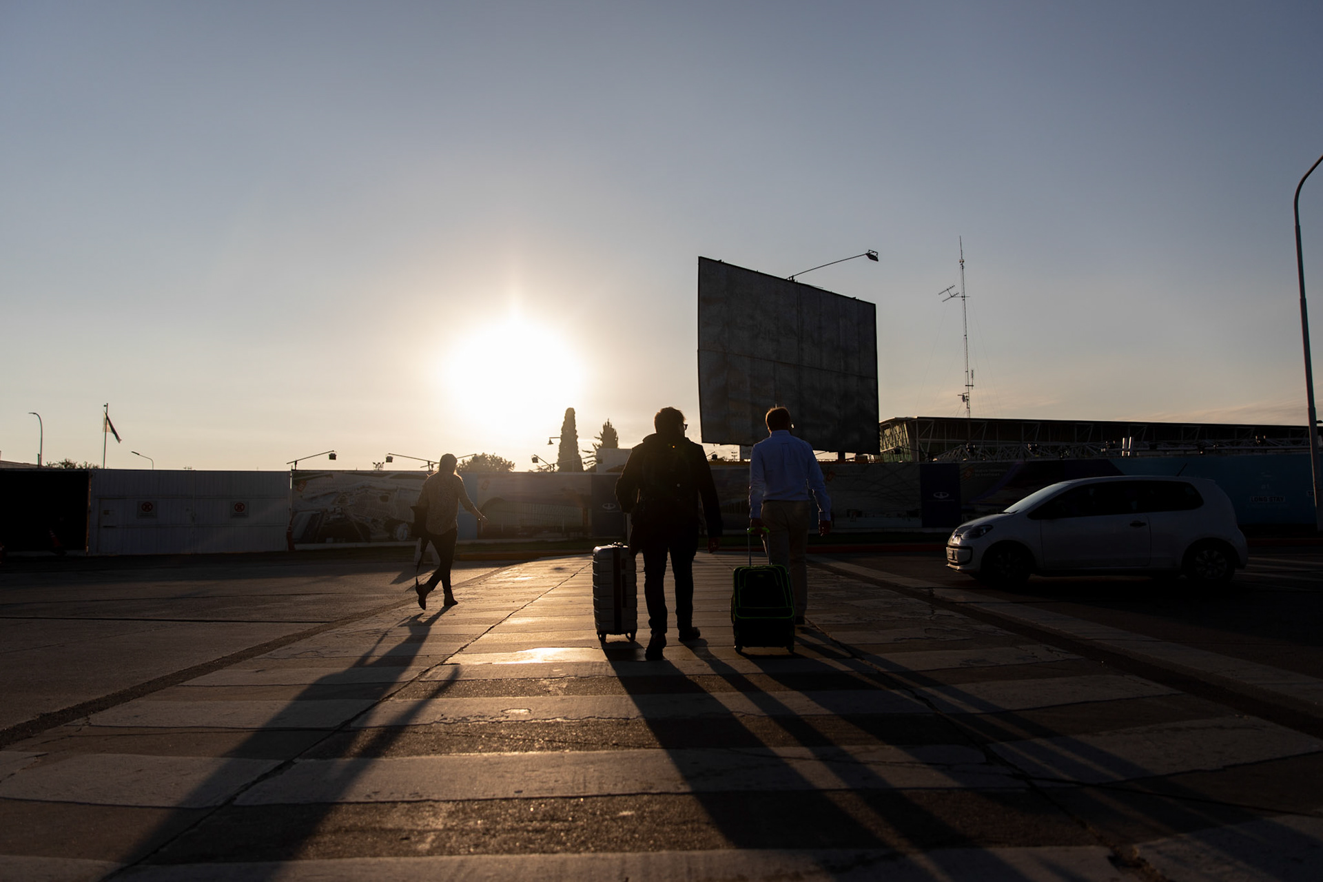 In this April 4, 2019, photo, Tomás Ruiz, 27, walks to the International Airport Ministro Pistarini, in Ezeiza, Buenos Aires, Argentina with his father, Pablo Ruiz. Before moving to Dublin, Ireland in search of work.