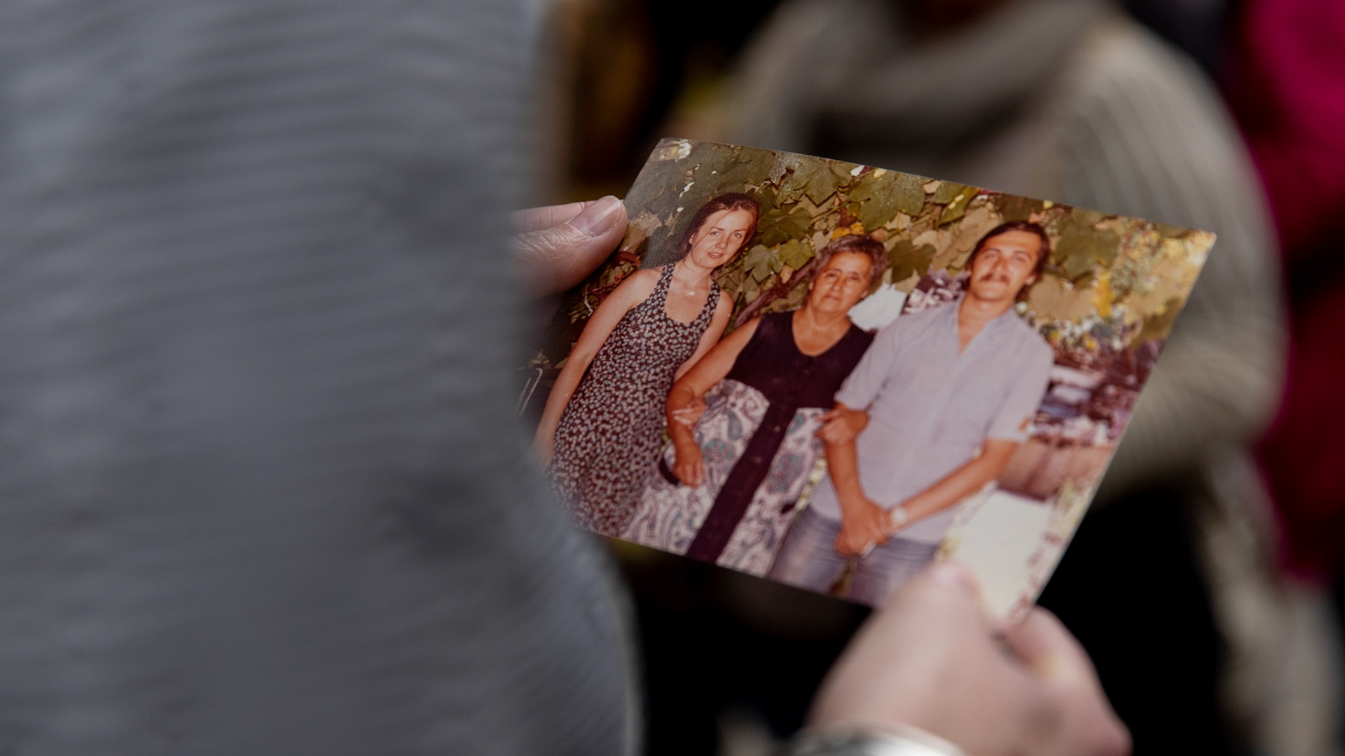 Bonnie Loedel holds a photo of Isabel Celia Loedel Maiztegui’s with her partner Julio Di Giacinti at the La Plata Cementery in the city of La Plata, Buenos Aires.