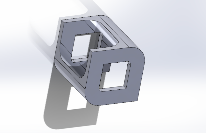 Cube with angled cutouts and filleted edges