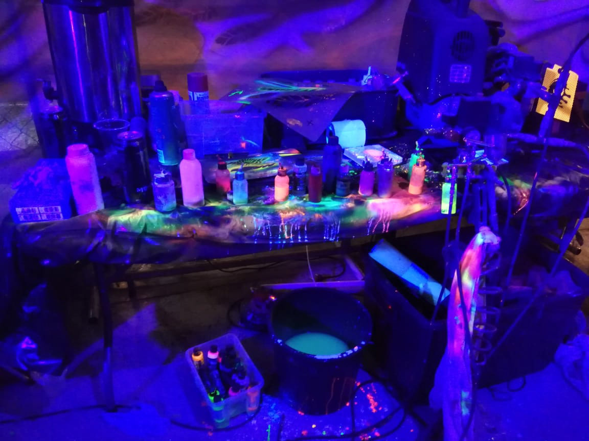 Diabolique Airbrush UV makeup table all under blacklight event setup