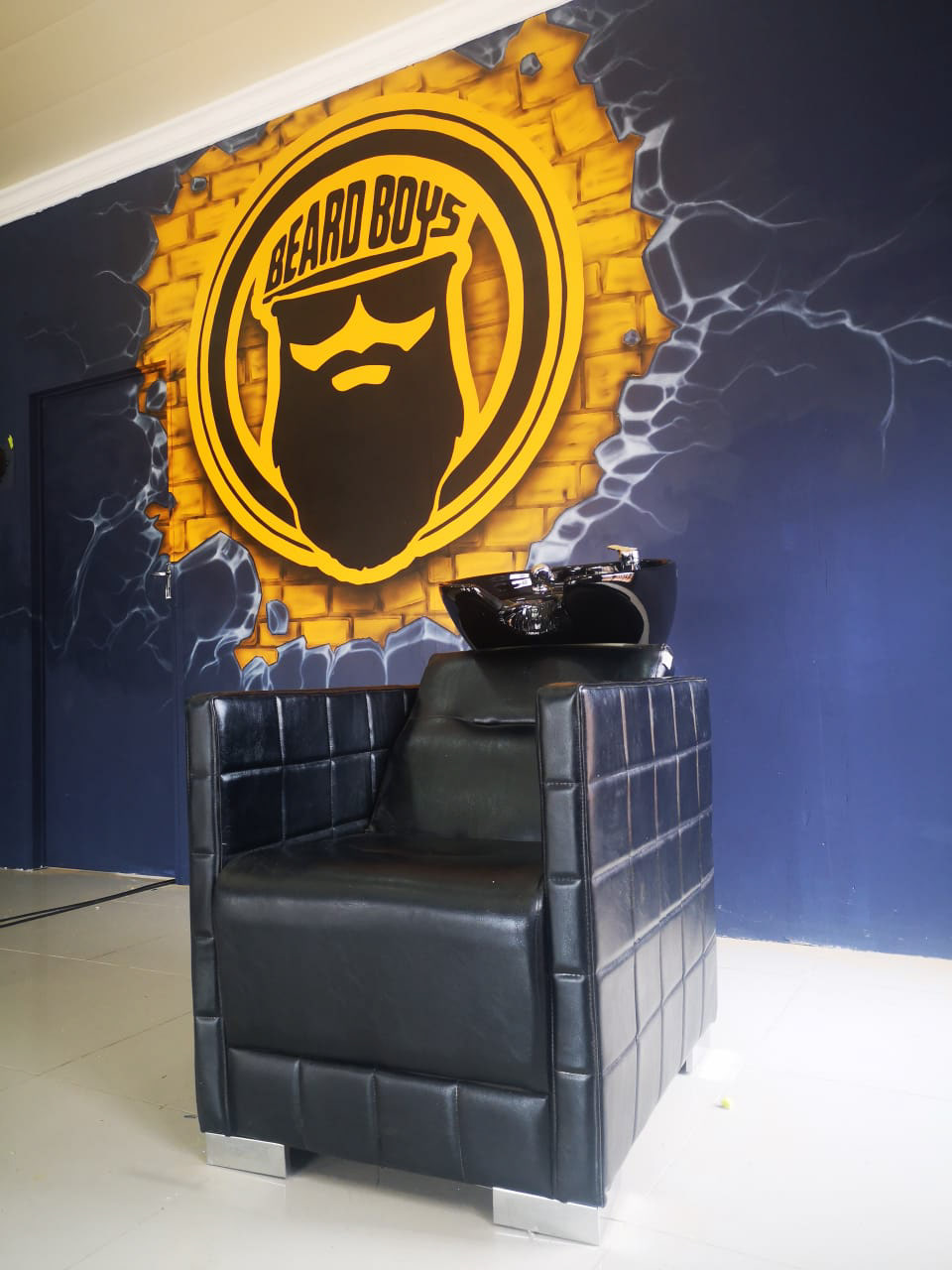 beardboys beard salon logo on bricks and wall break, airbrush spray gun wall mural