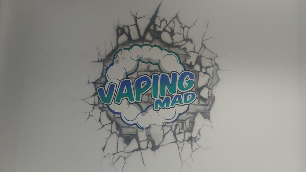 full color vaping mad logo on black and white bricks with wall break wall art mural airbrushed shop wall