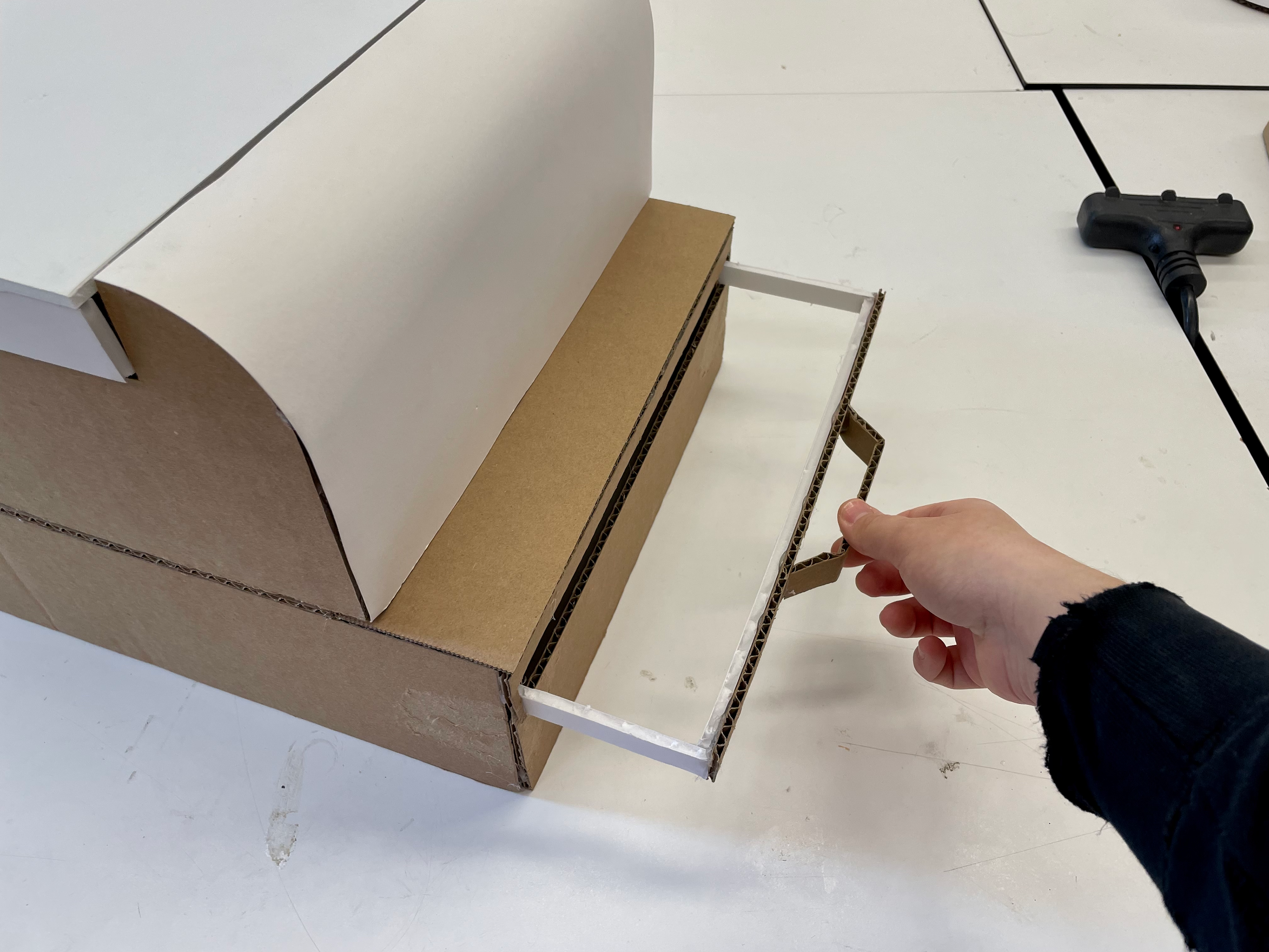 Handle pulls out to create a shelf
