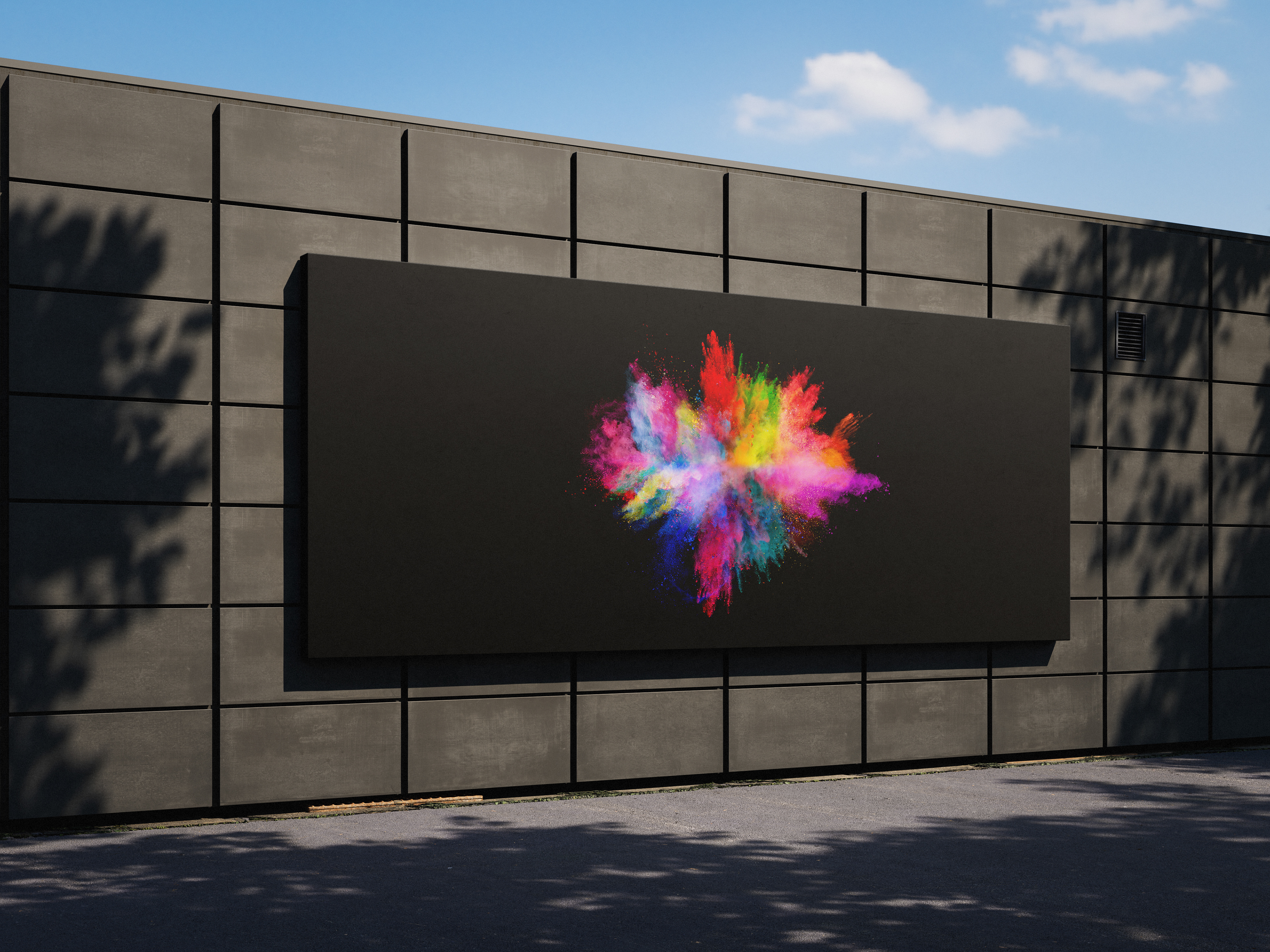 Large black billboard displaying vibrant explosion of multicolored powder.