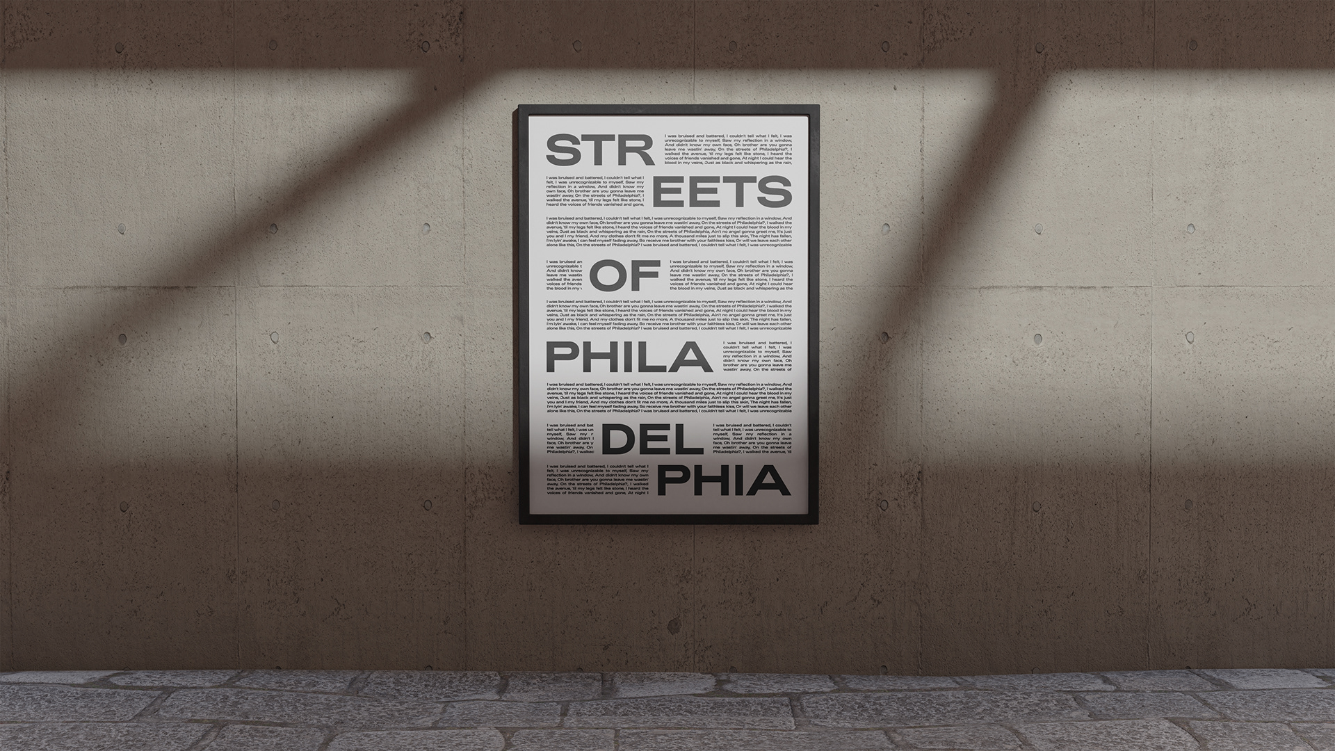 Framed black-and-white typographic poster reading STREETS OF PHILADELPHIA, with bold staggered text and smaller body copy creating modern editorial rhythm.