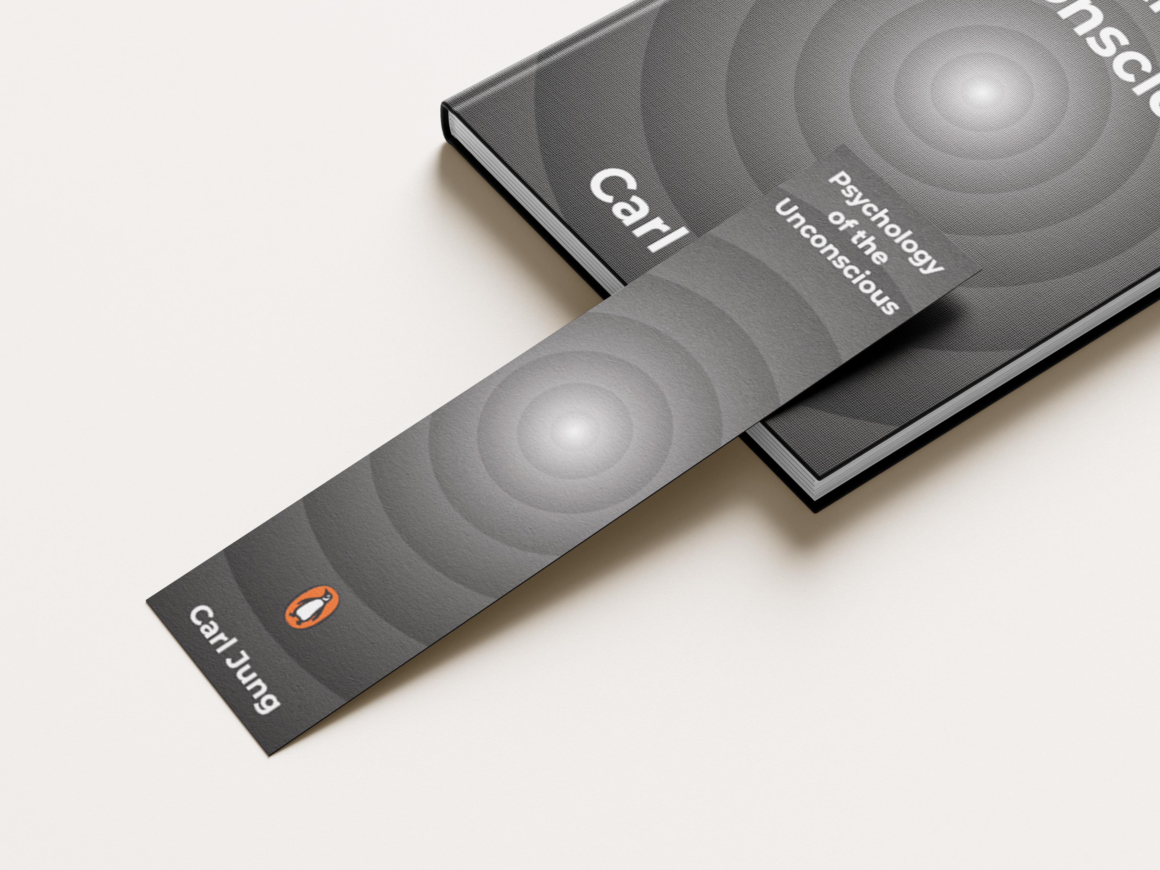 Hardcover book and bookmark design for Carl Jung’s Psychology of the Unconscious with grayscale concentric circle motif, white typography, and Penguin logo.