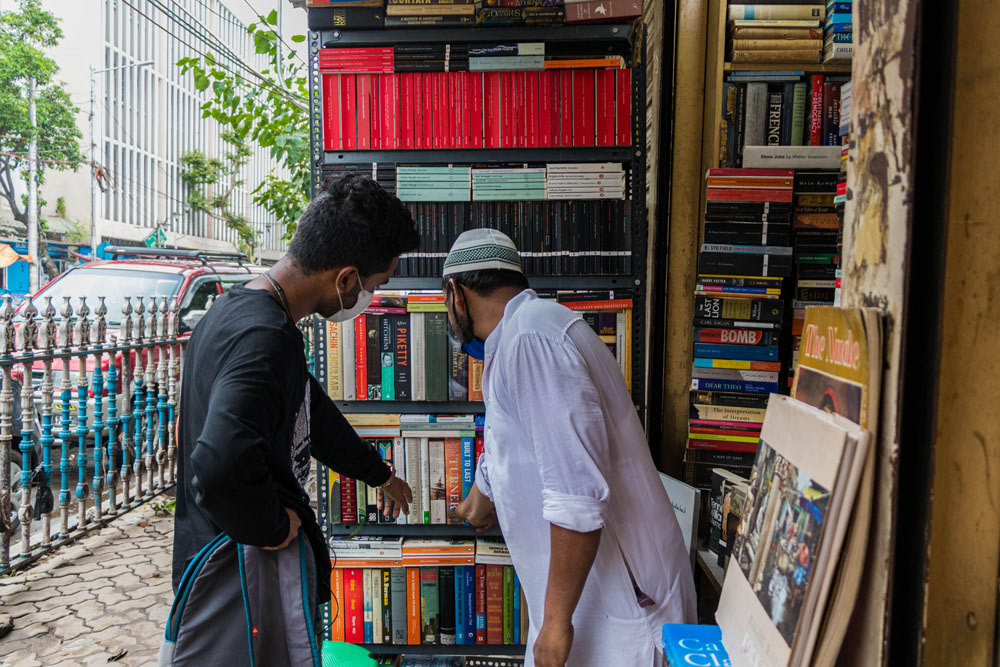 Book stall owner with customer