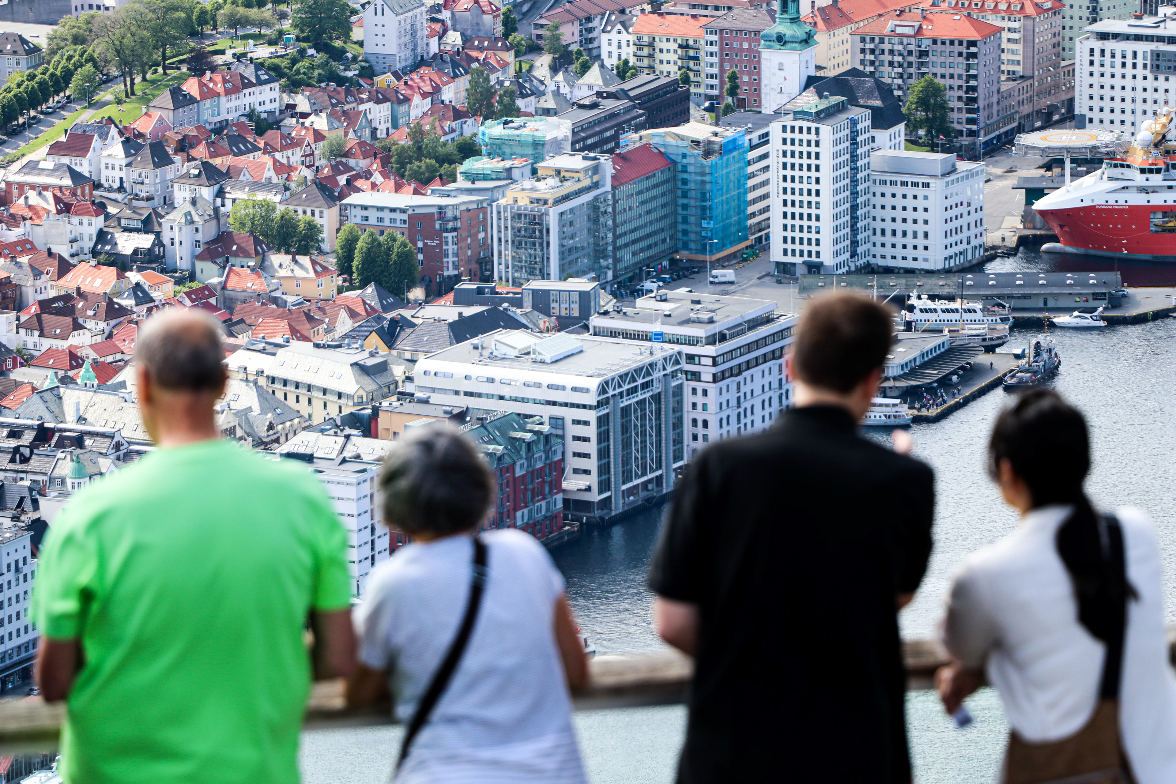 Visitors atop Mount Floyen take in the view of the city of Bergen, Norway