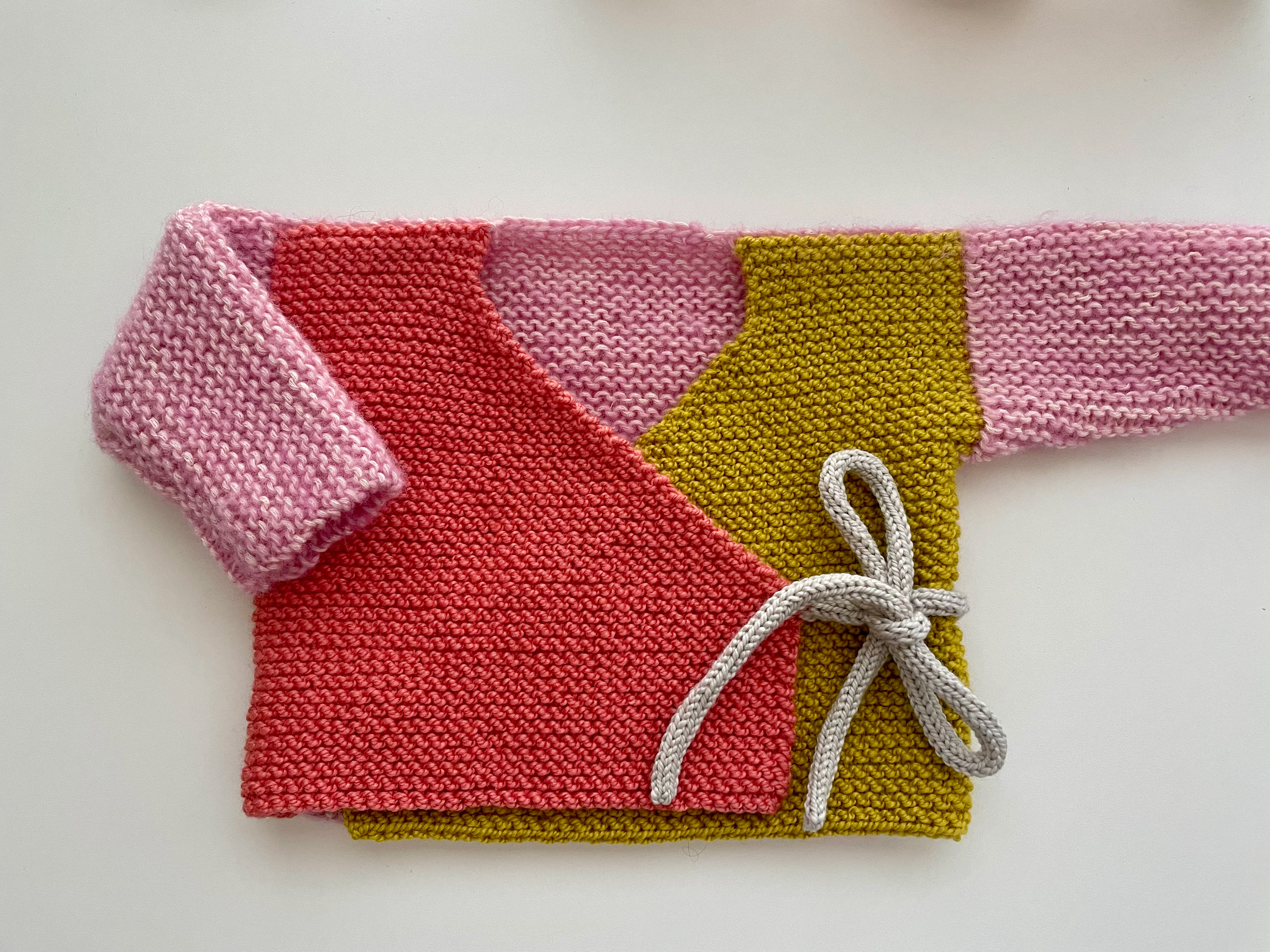 I knit this baby ballet sweater for a friend's newborn