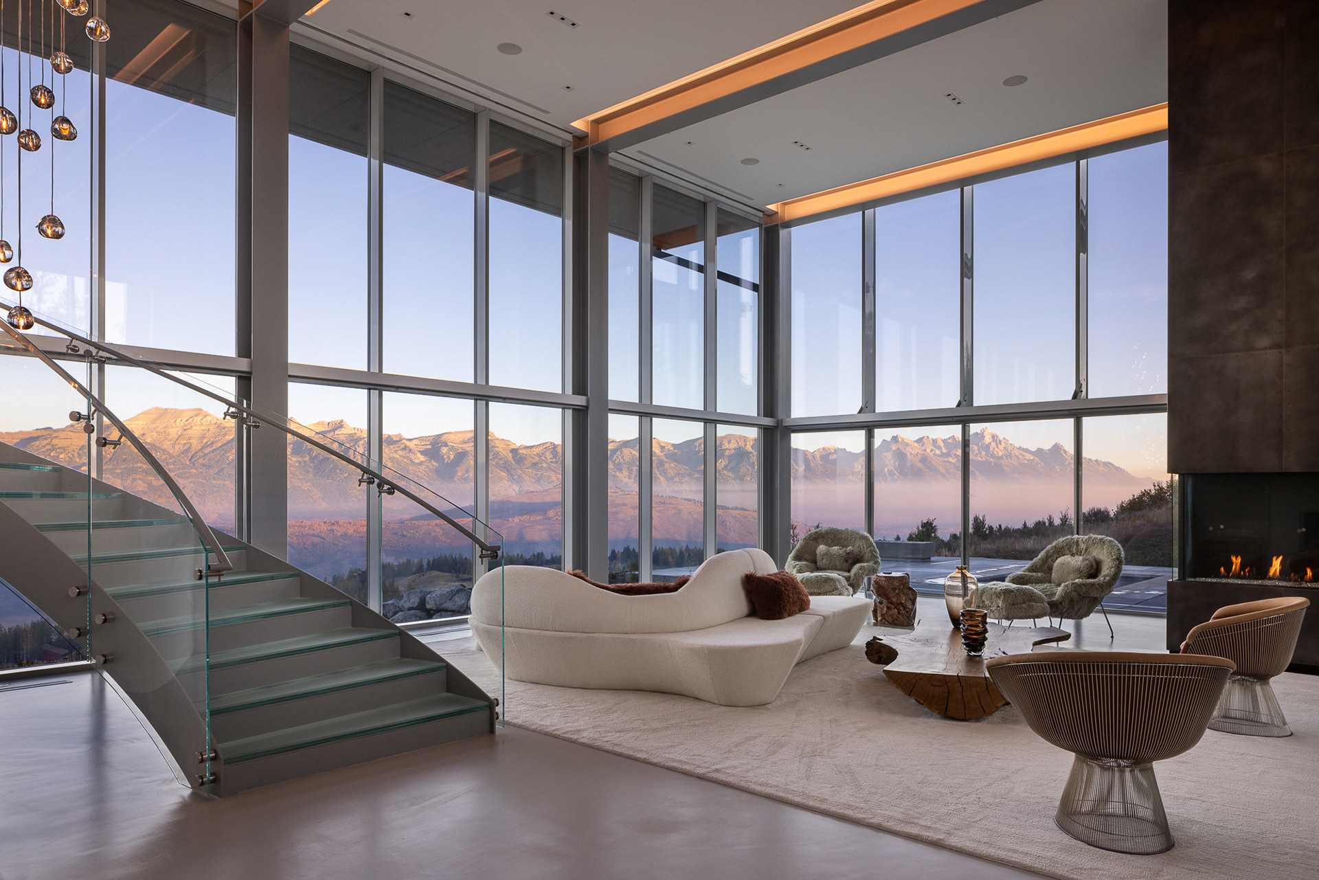 Sunrise, architectural photograph of the modern home designed by Reid Smith Architects. View of the Teton Range. Photograph by architectural interior design photographer Aaron Kraft of Krafty Photos. Jackson Hole Wyoming